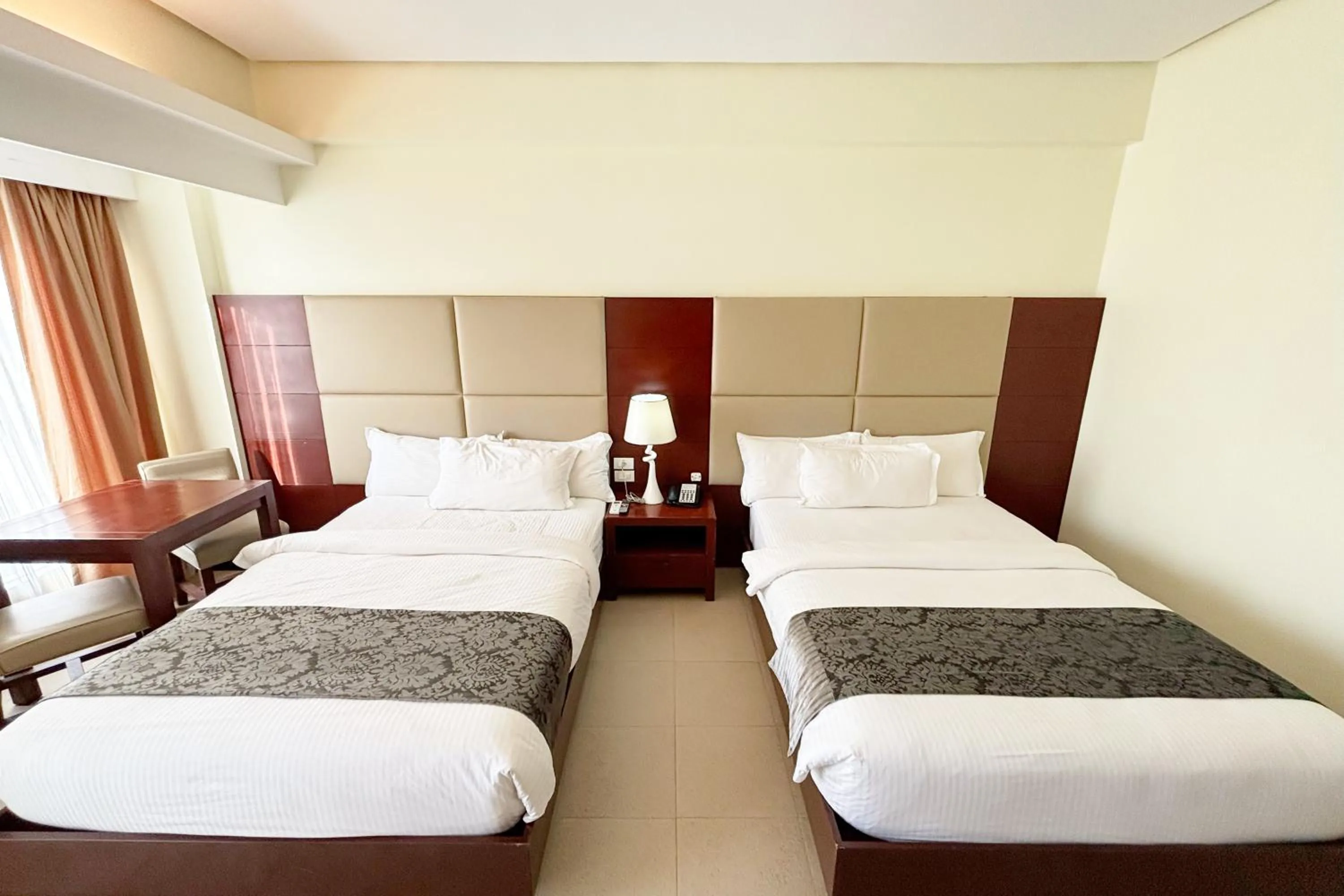 Bed in The Muse Beach Front Hotel Boracay