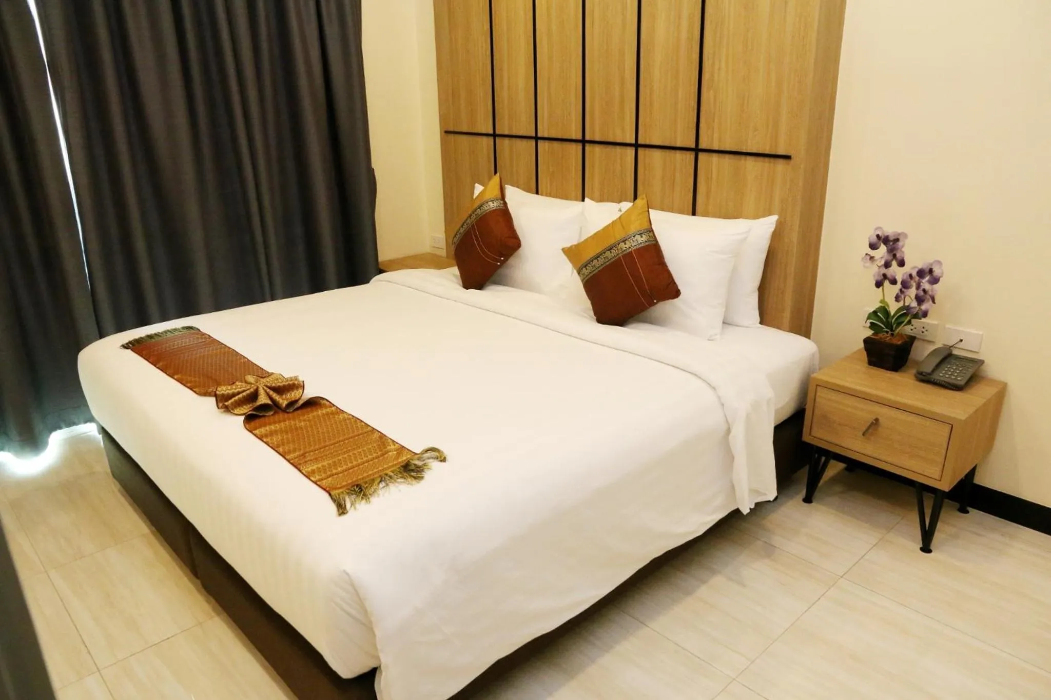 Bed in Crystal Palace Luxury Hotel Pattaya