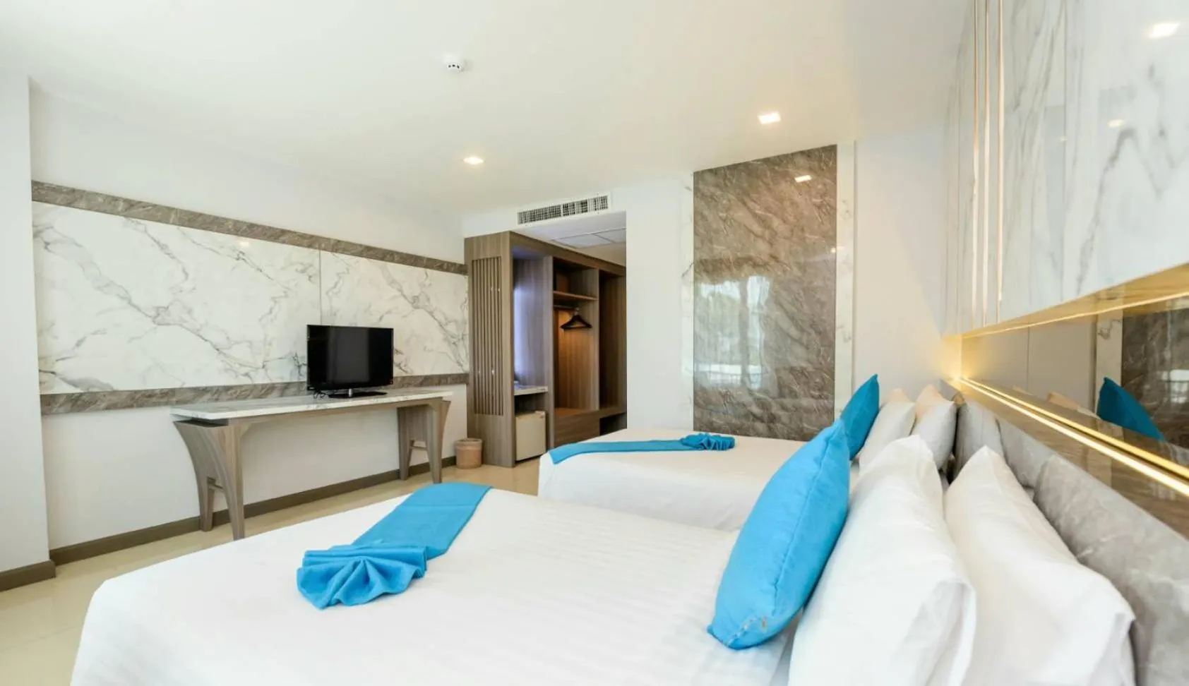 Bed in Crystal Palace Luxury Hotel Pattaya