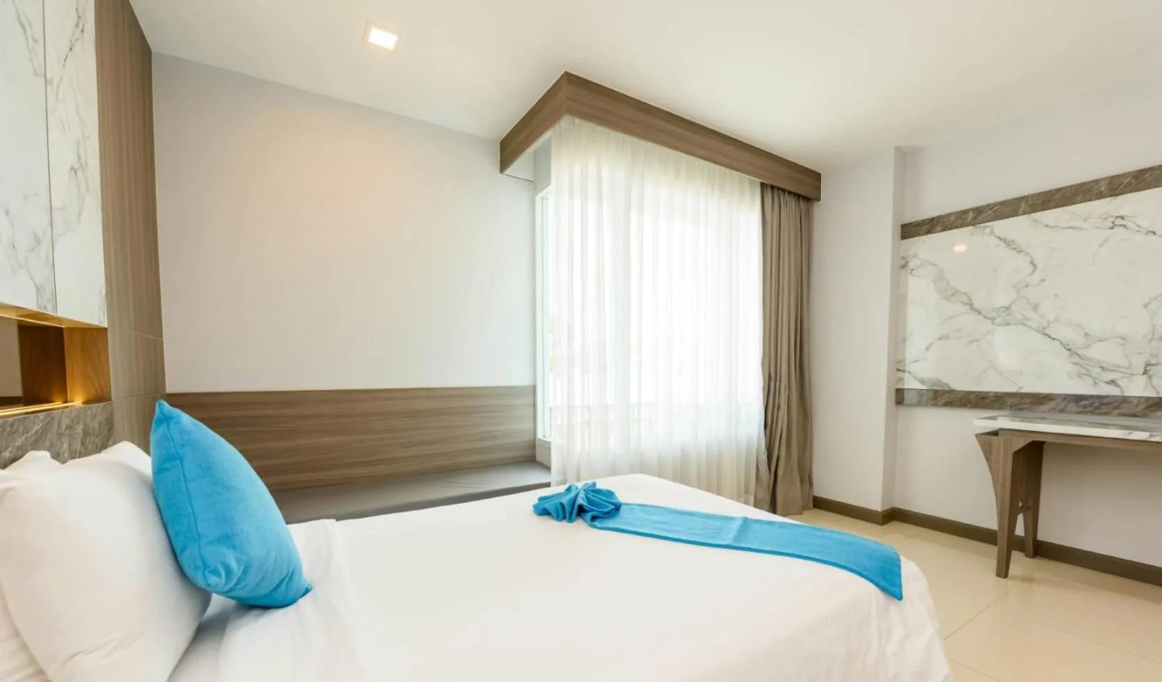 Bed in Crystal Palace Luxury Hotel Pattaya