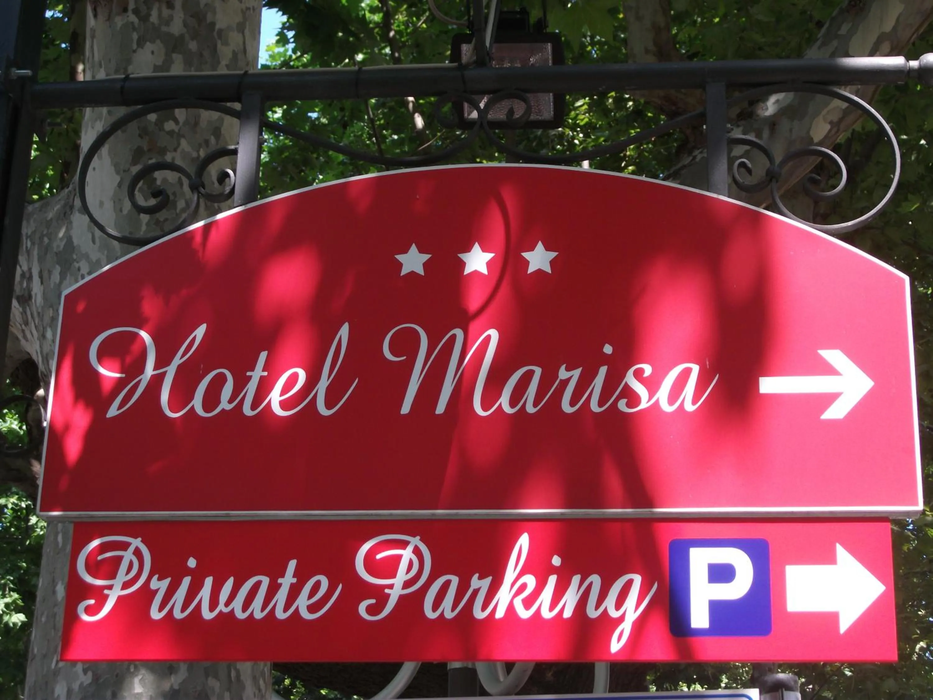 Property logo or sign in Hotel Marisa
