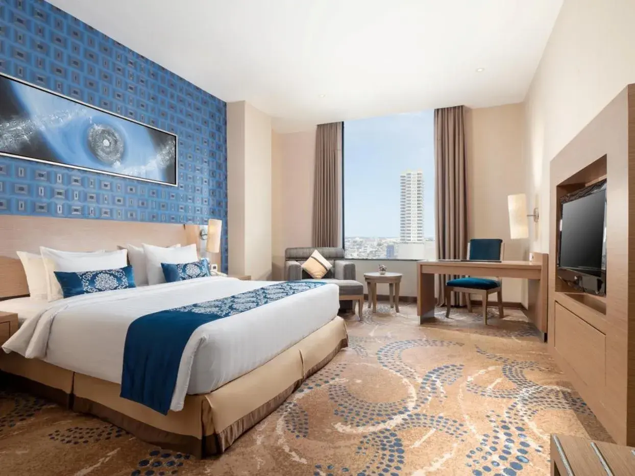 Bed in Grand City Hall Hotel & Serviced Residences Bed in Grand City Hall Hotel & Serviced Residences