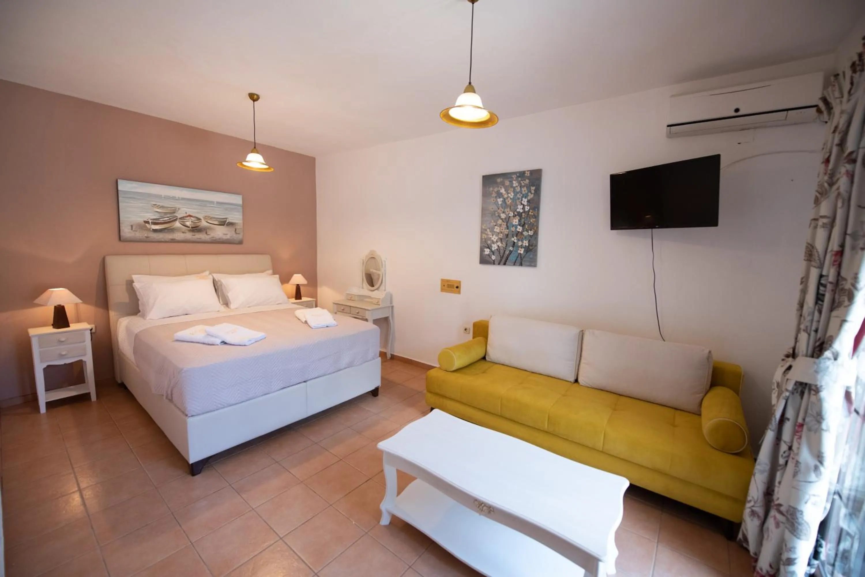 Bed in Hovolo Hotel Apartments