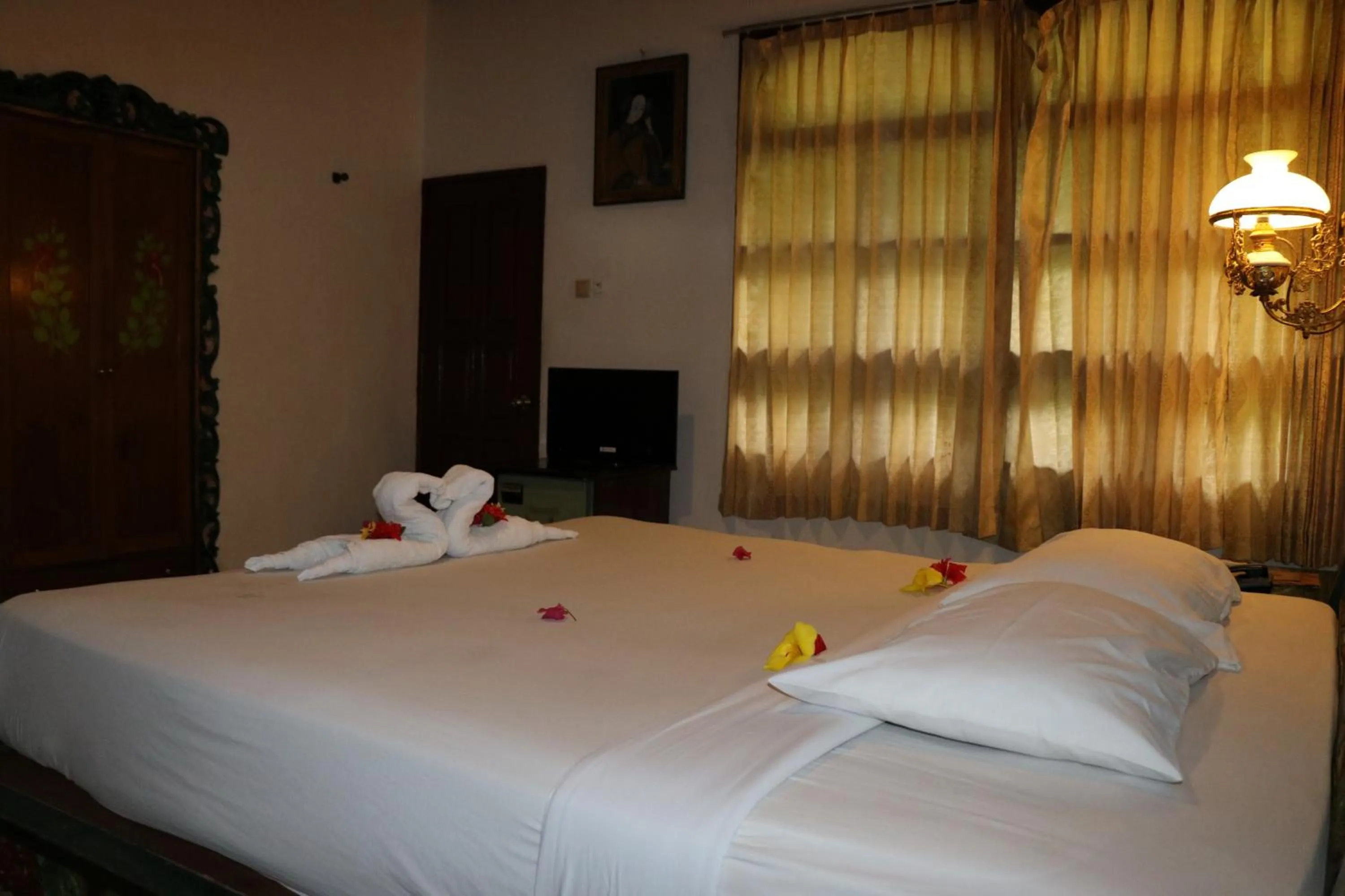 Bed in Puri Bunga Beach Cottages