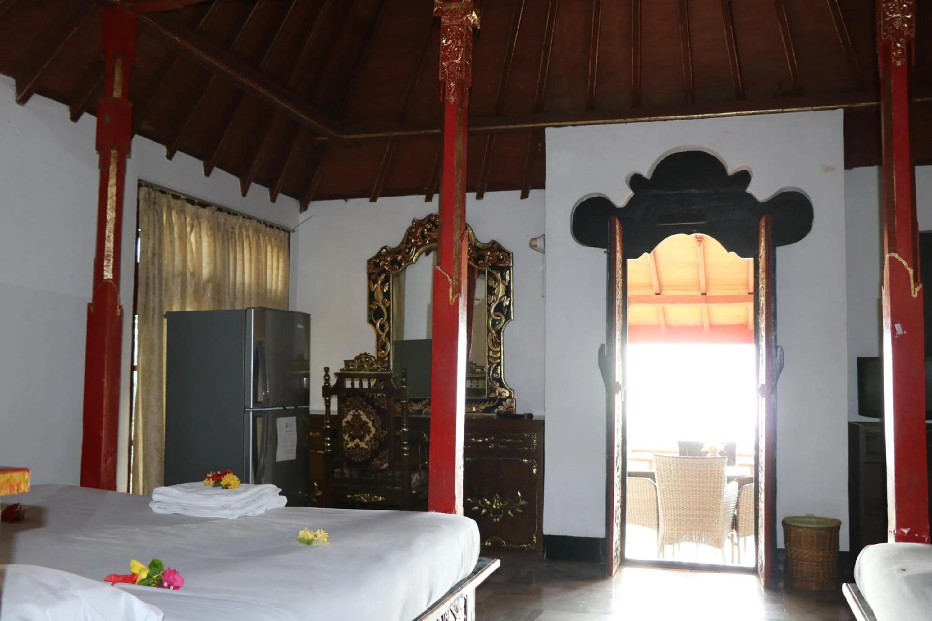 Bed in Puri Bunga Beach Cottages