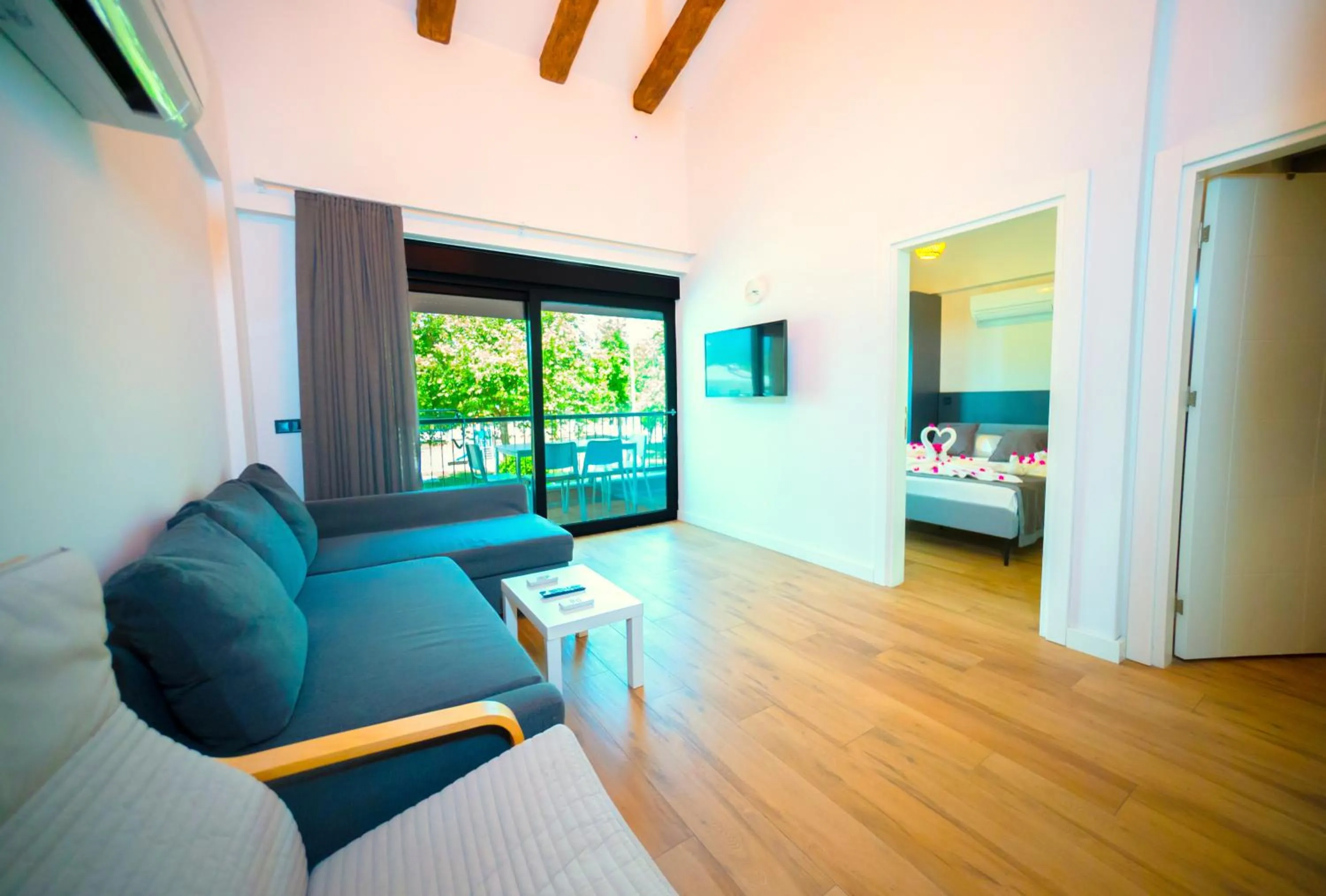 Living room, Bed in Sweet Home Kemer Apartments