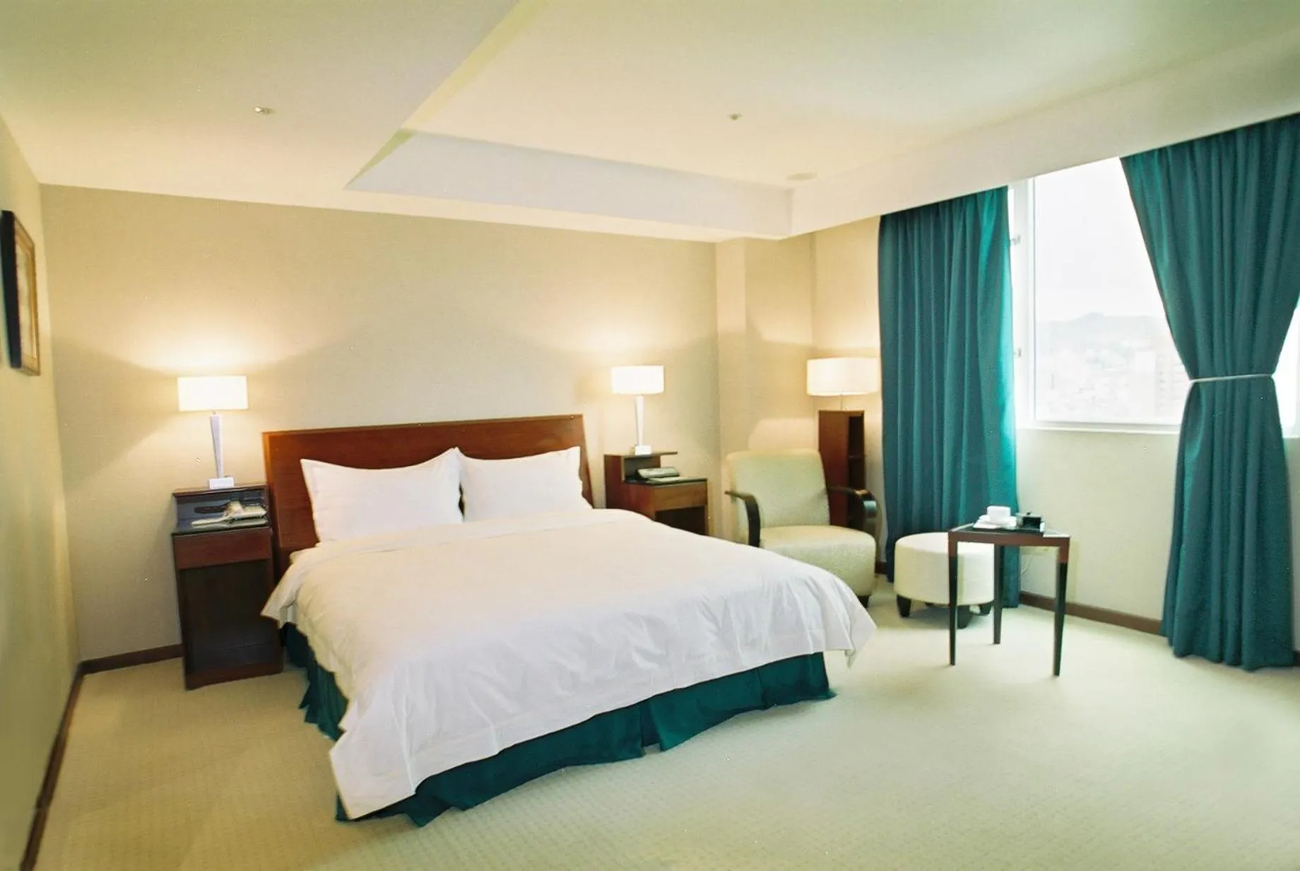 Bed in Family Hotel Taipei