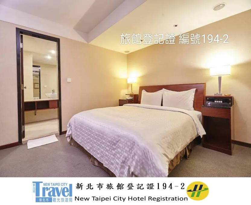 Bed in Family Hotel Taipei