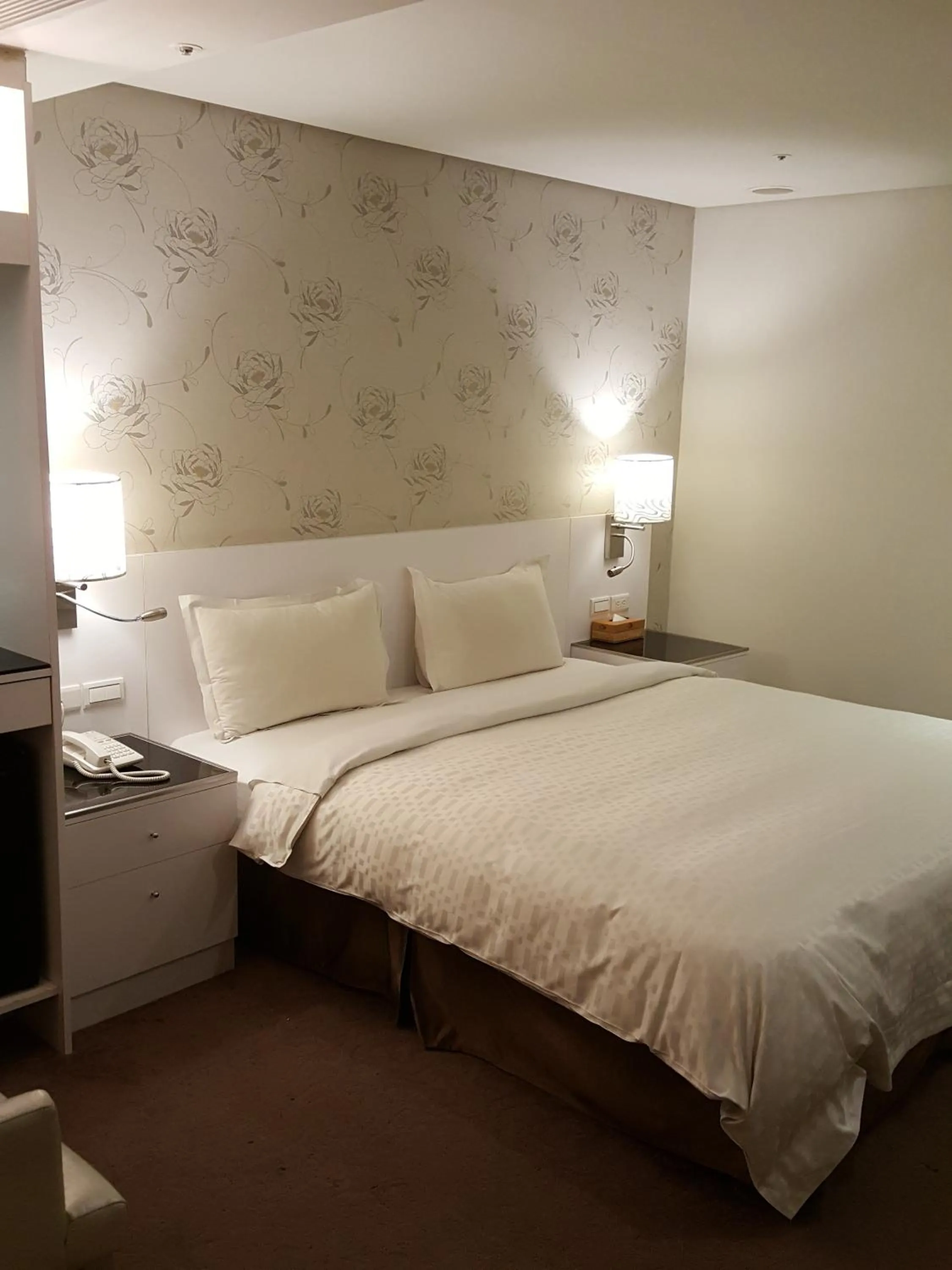 Bed in Family Hotel Taipei