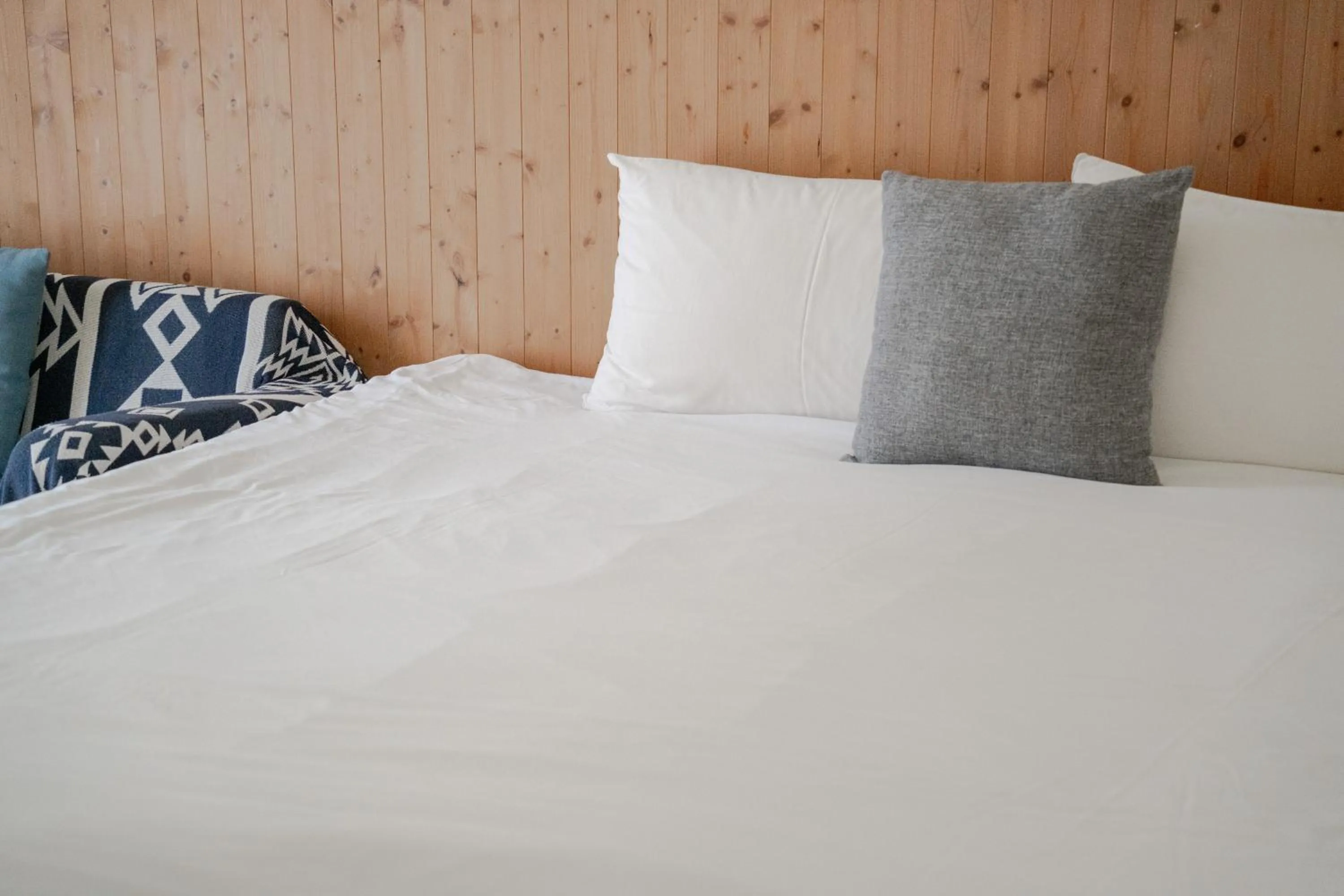 Bed in Cozy Green Guesthouse