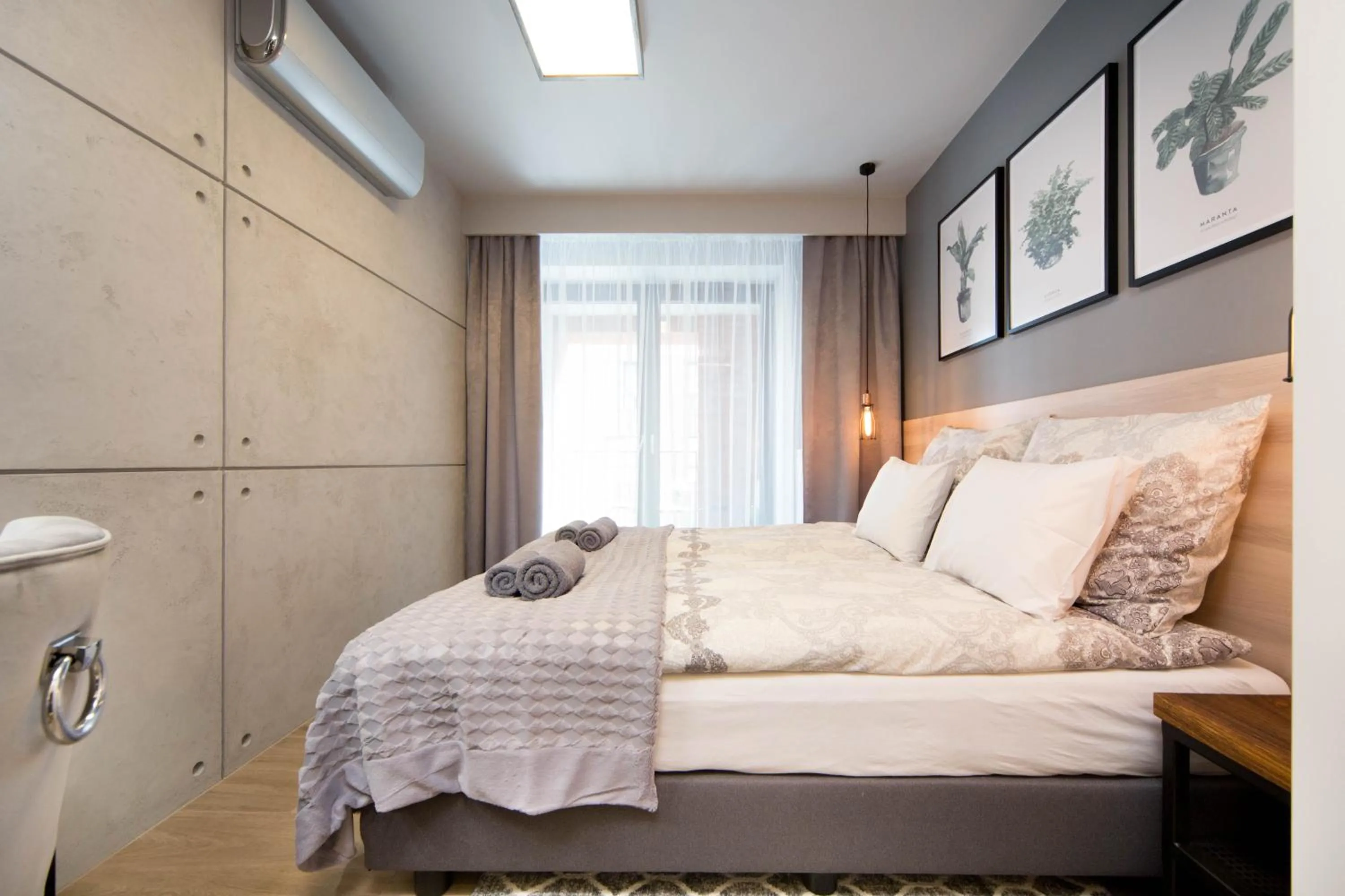 Bed in Jacuzzi Apartments