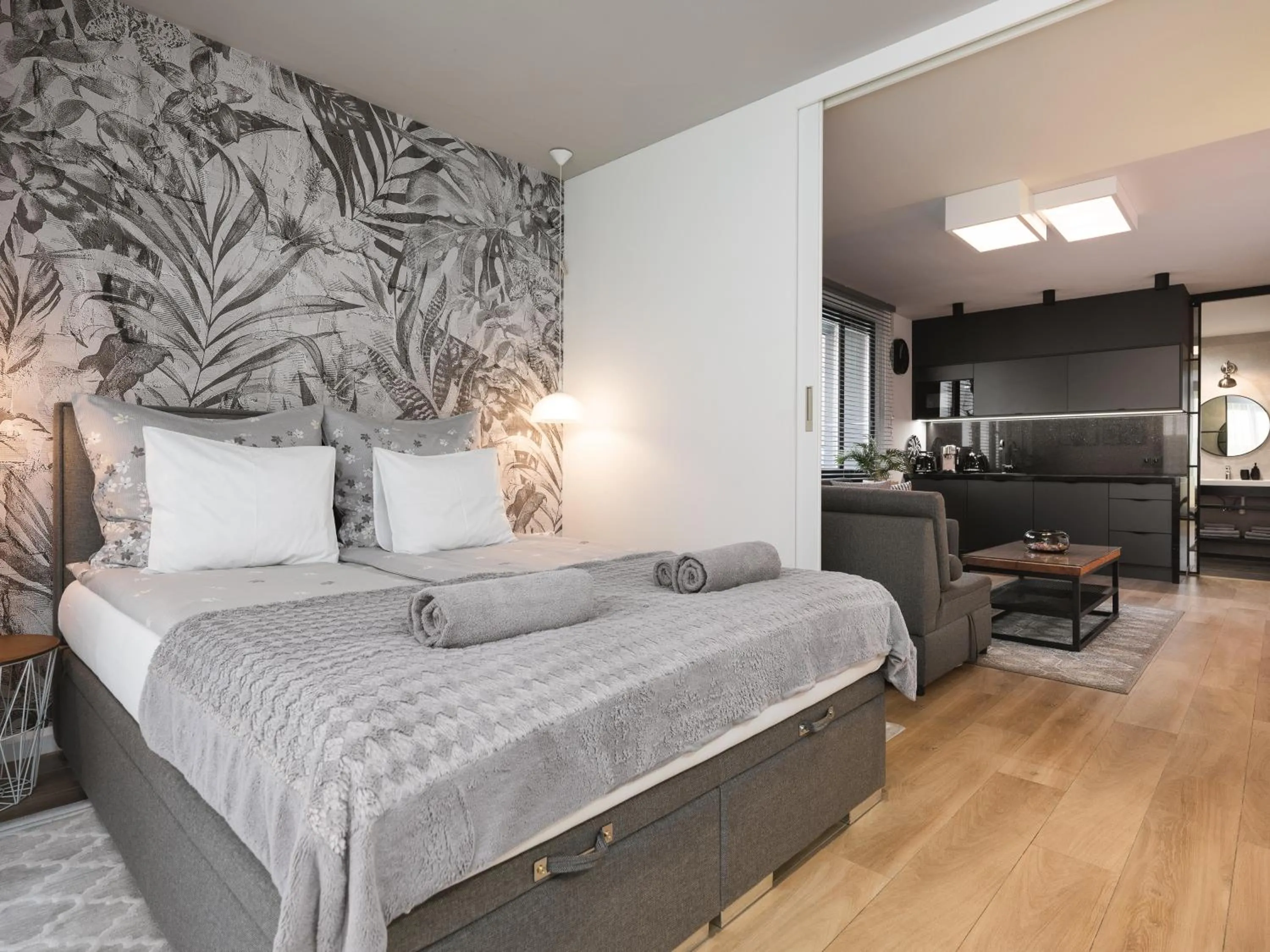 Bed in Jacuzzi Apartments