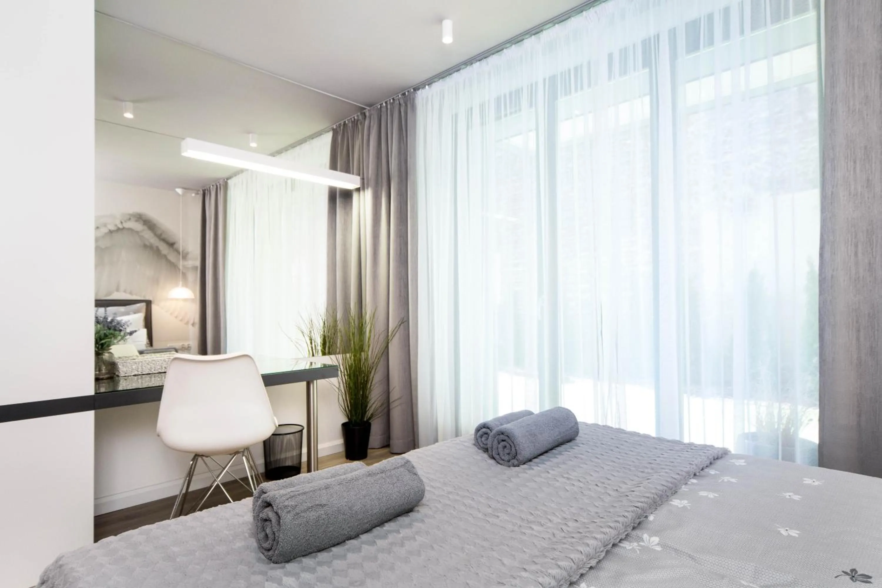 Bed in Jacuzzi Apartments