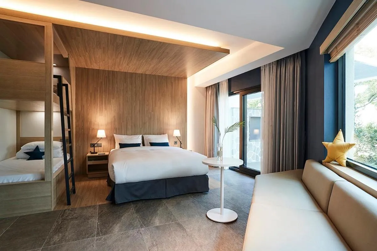 Bed in The Suites Hotel Jeju