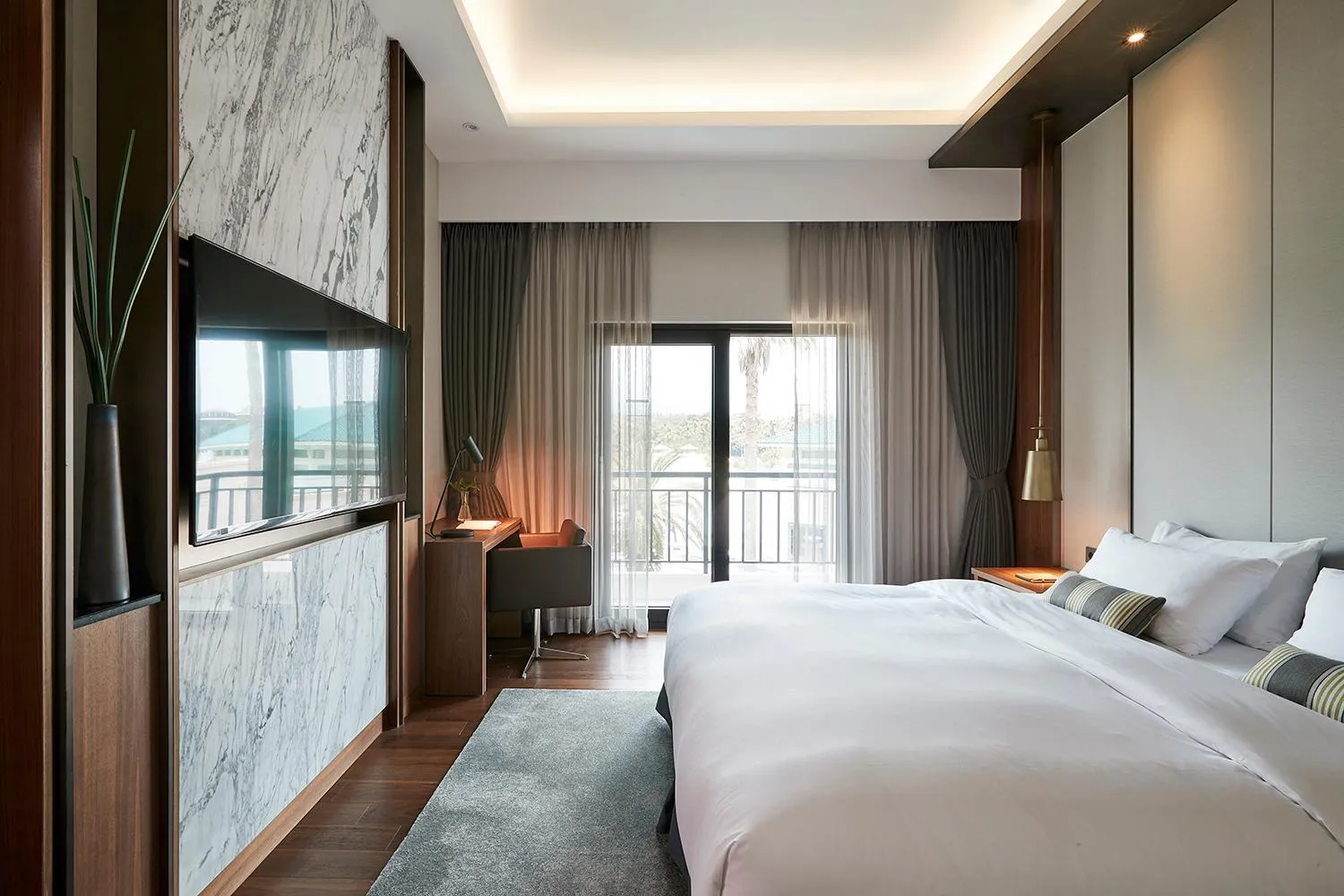 Bed in The Suites Hotel Jeju