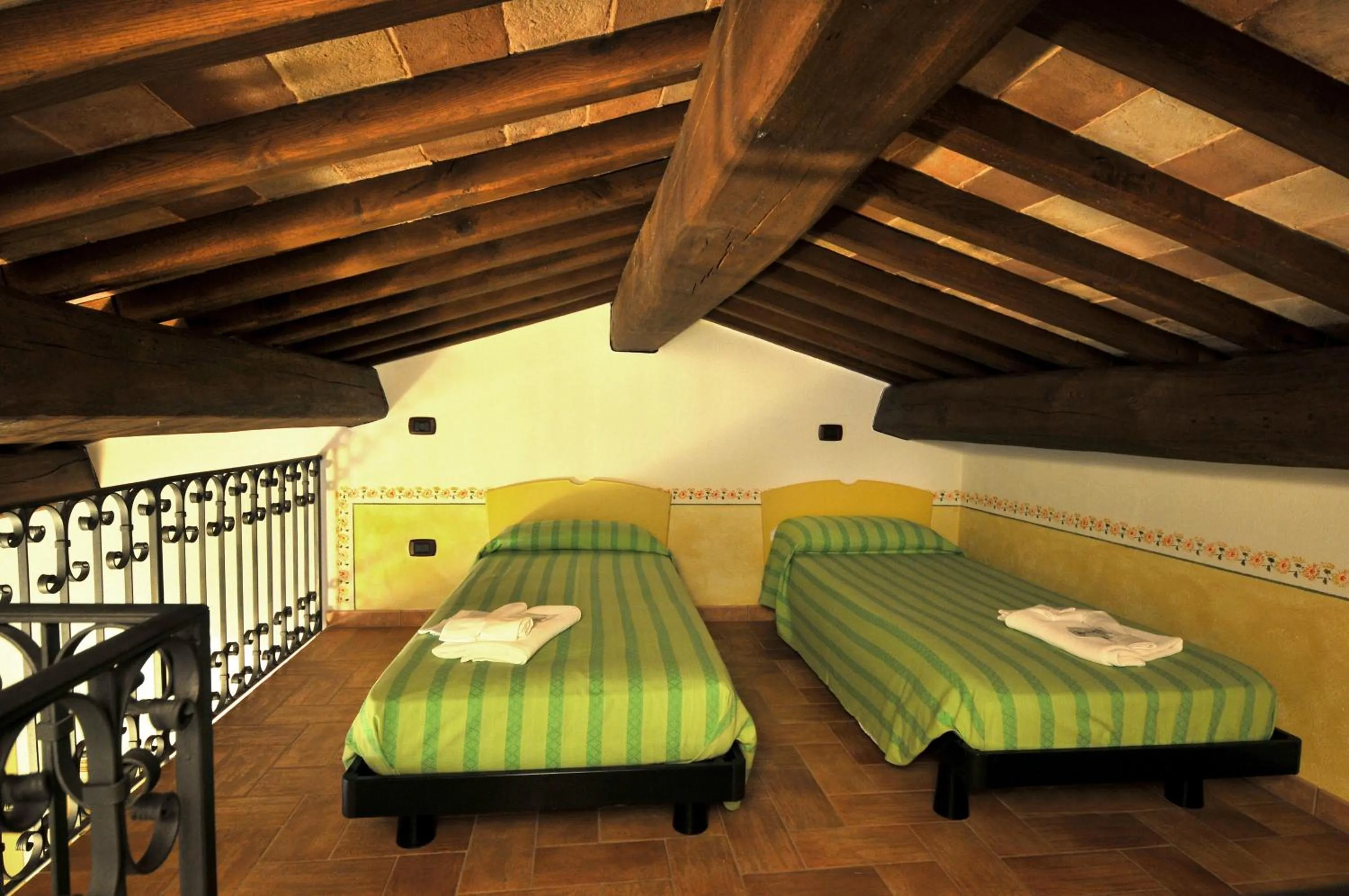 Bed in Terre Del Cantico Country House