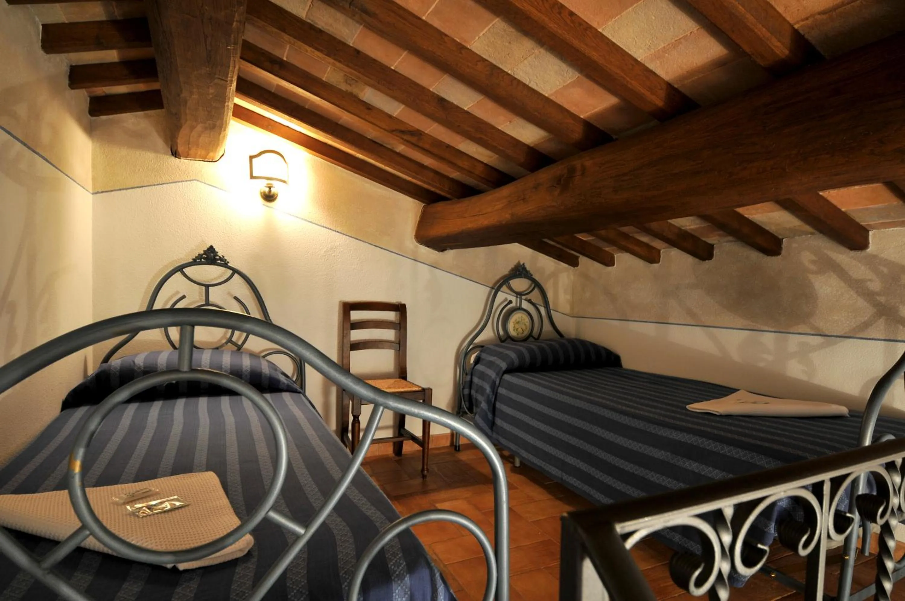 Bed in Terre Del Cantico Country House