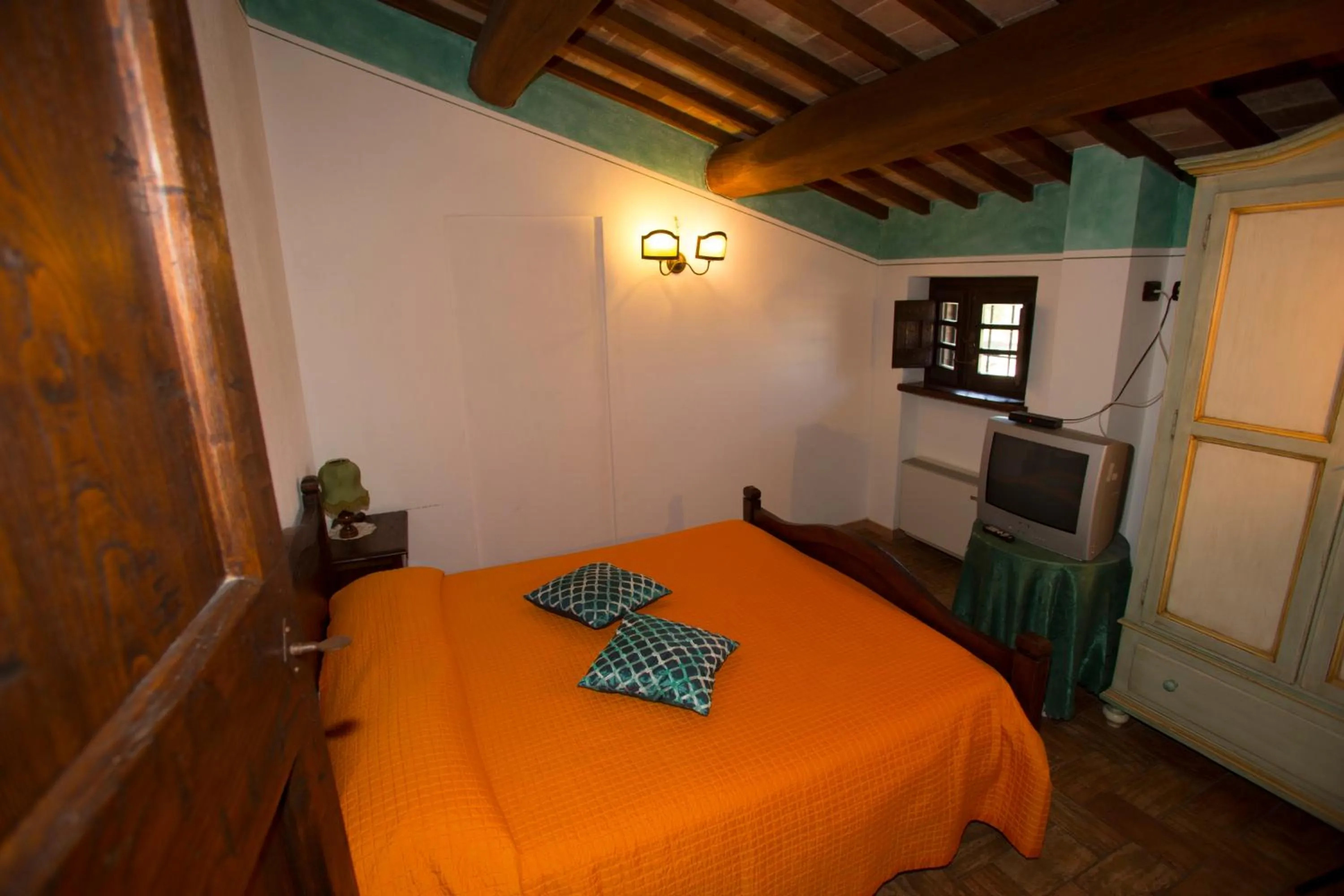 Bed in Terre Del Cantico Country House