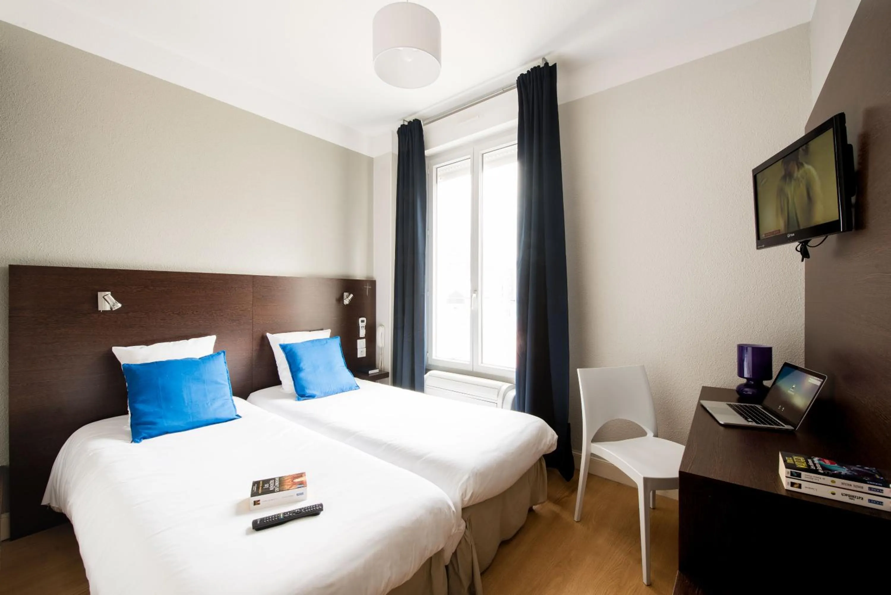 Bedroom in Hôtel Atrium