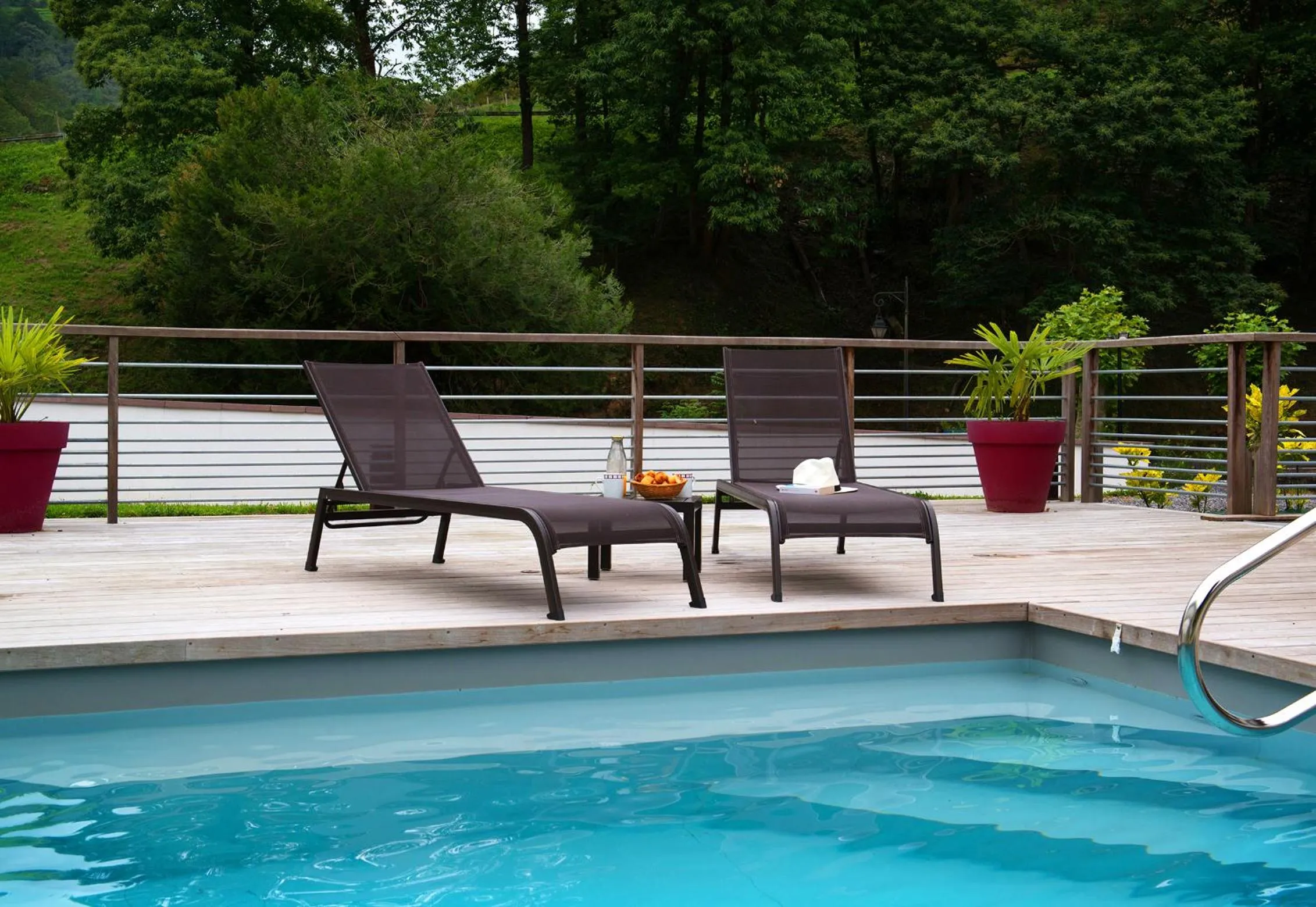 Swimming pool in Logis Hôtel Andreinia & Cabanes