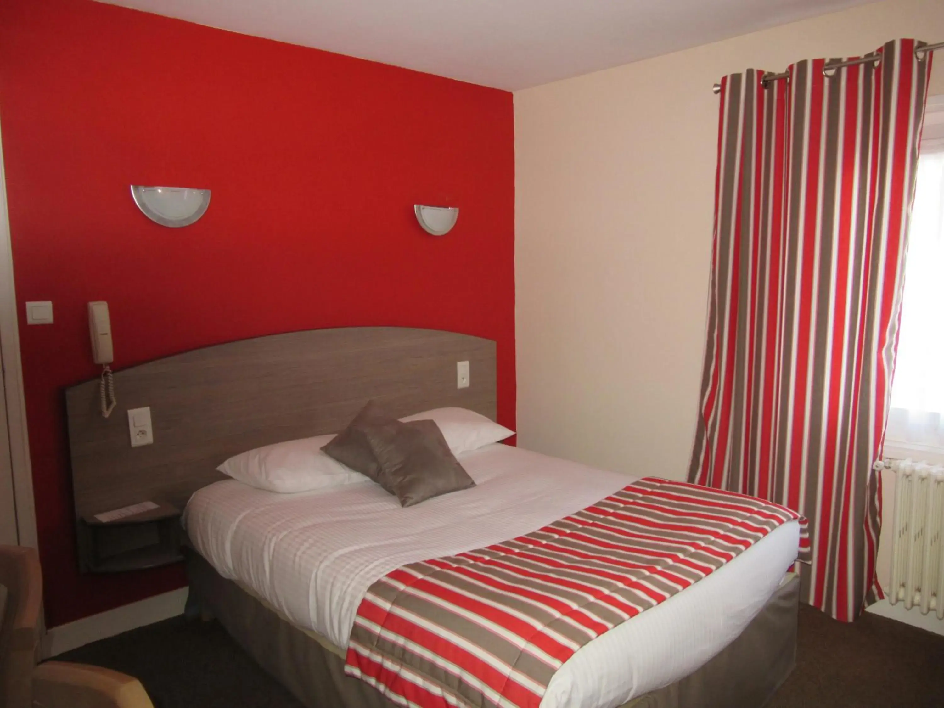 Bed in Logis Hôtel Andreinia & Cabanes Bed in Logis Hôtel Andreinia & Cabanes