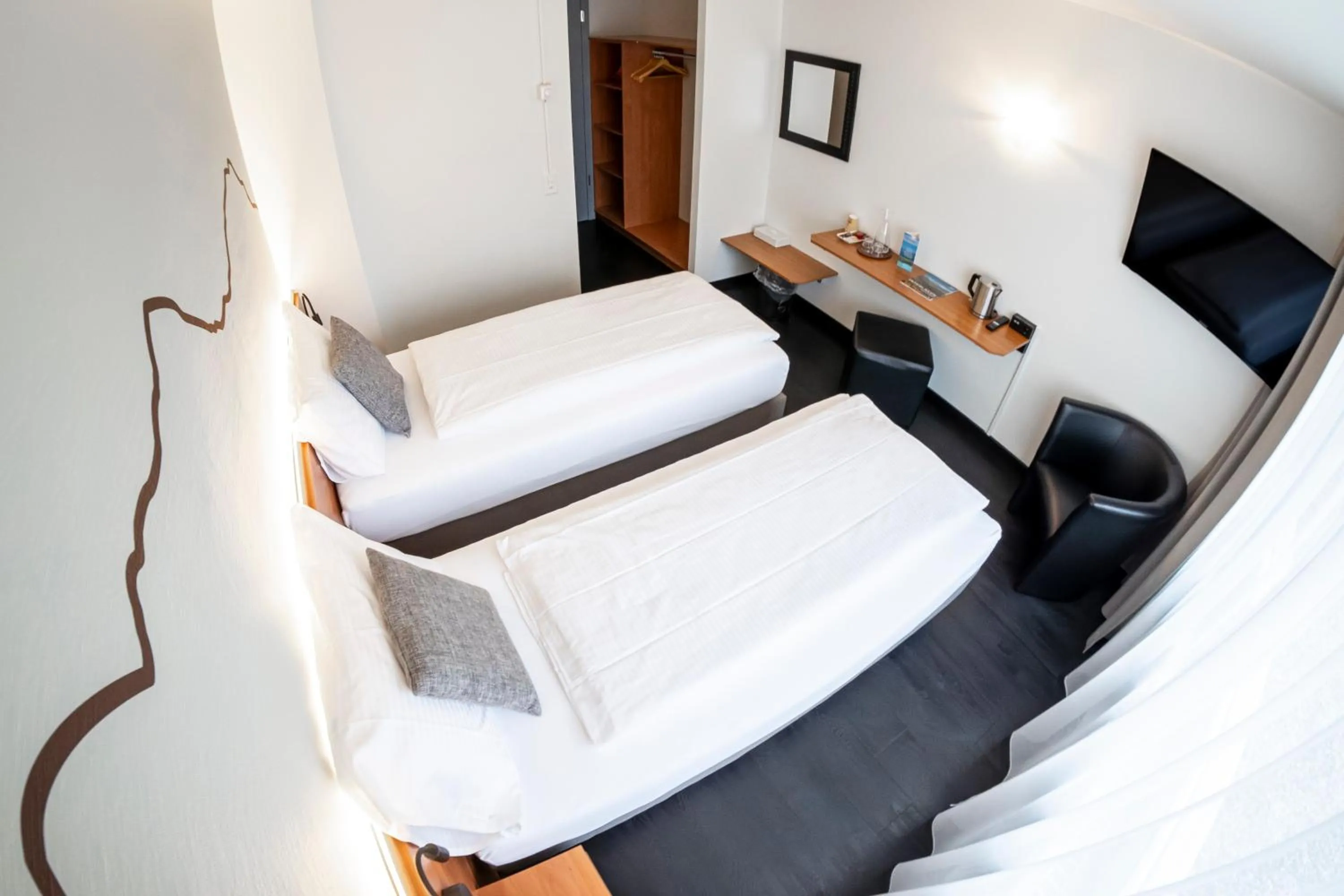 Bed in Hotel Merkur - West Station