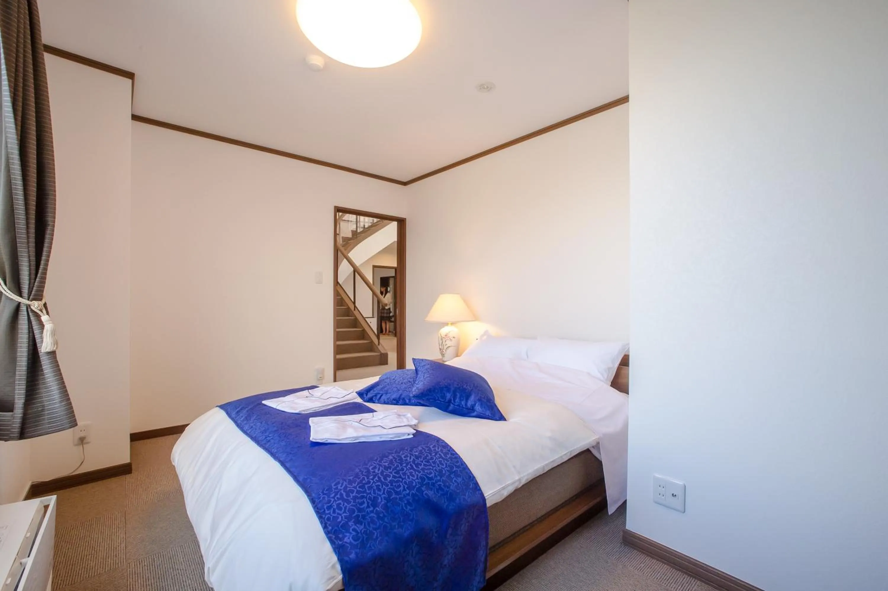 Photo of the whole room, Bed in Condominium Panoramique Motomachi