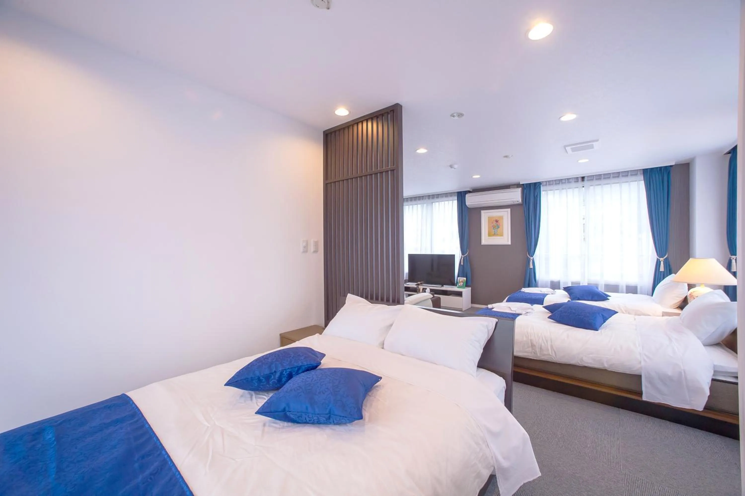 Photo of the whole room, Bed in Condominium Panoramique Motomachi