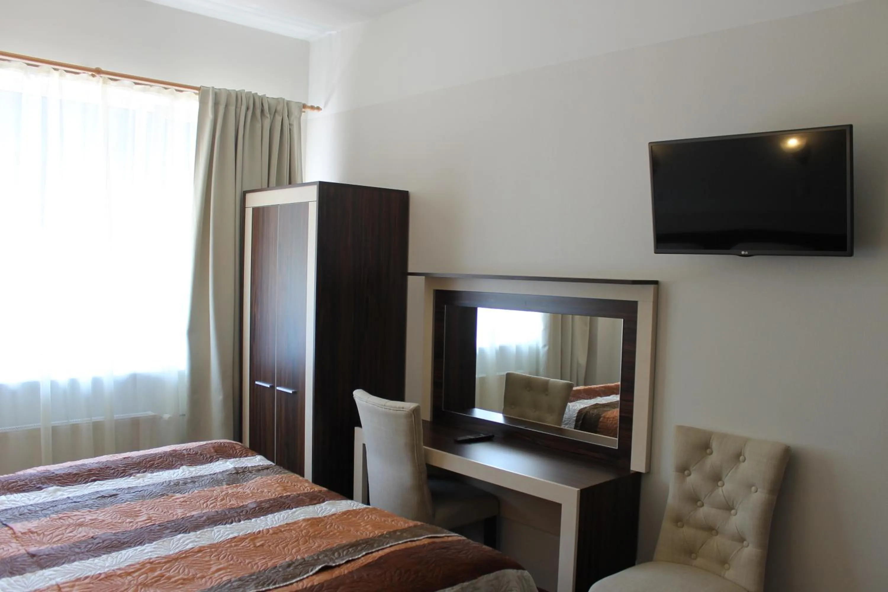 Bed in Ecoland Hotel