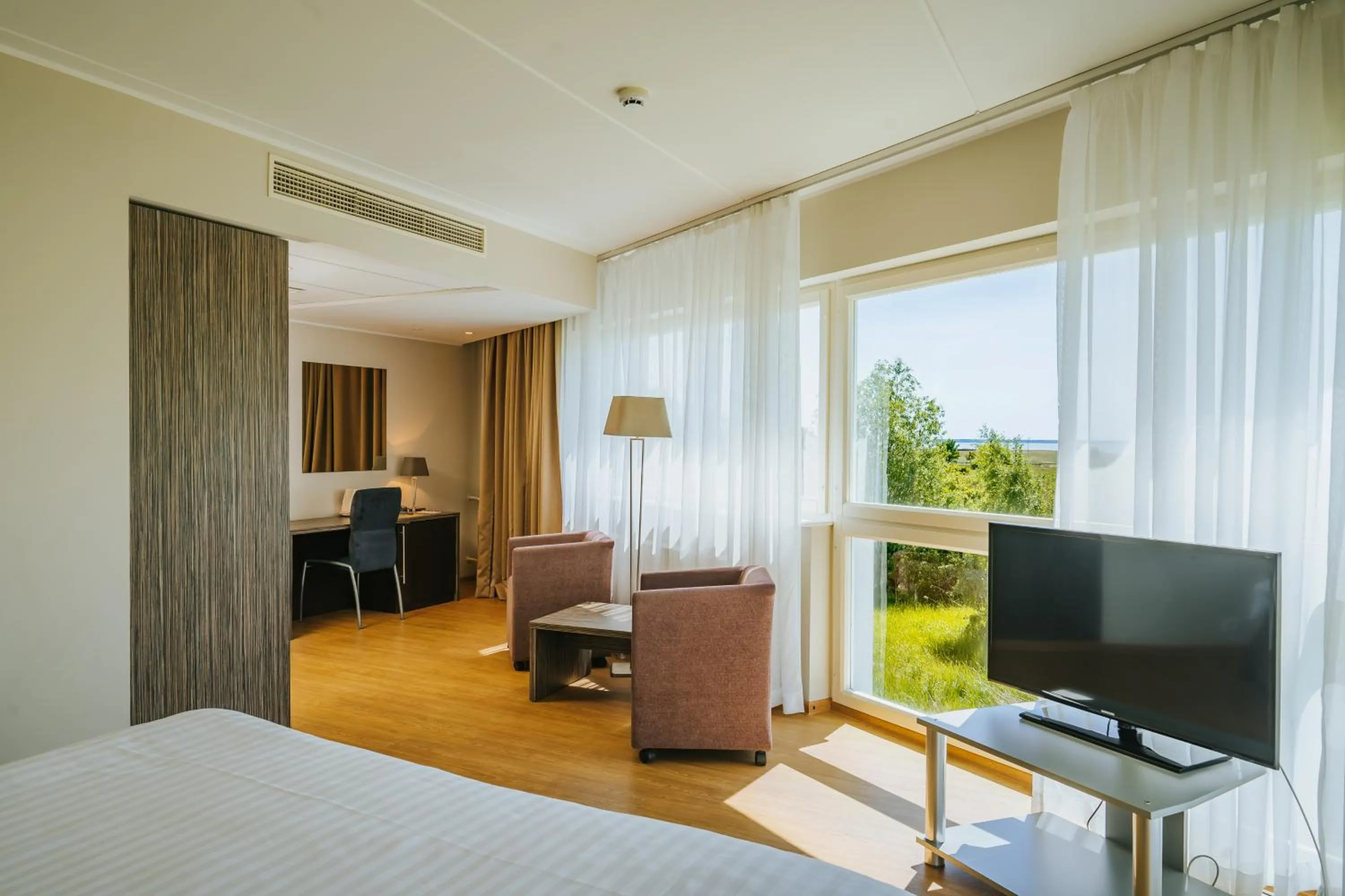 Seating area, Bed in Hestia Hotel Strand