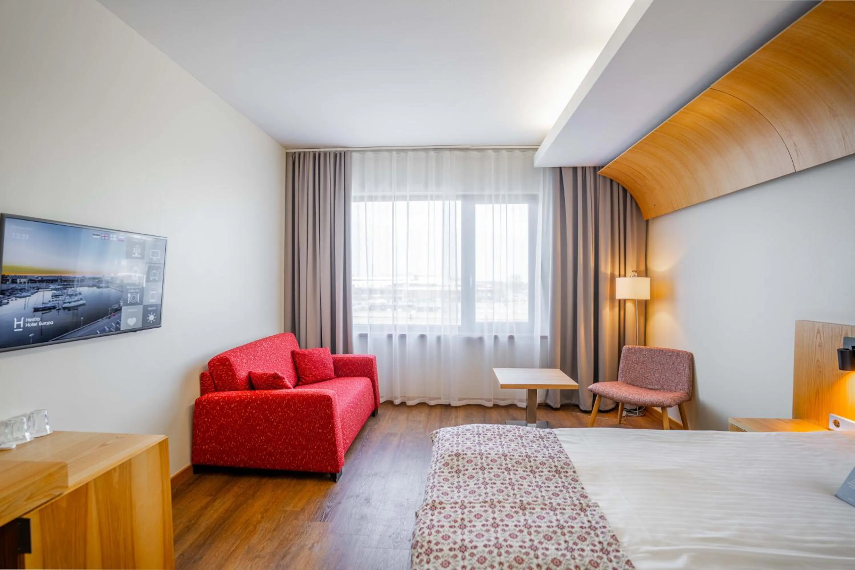 Seating area, Bed in Hestia Hotel Europa