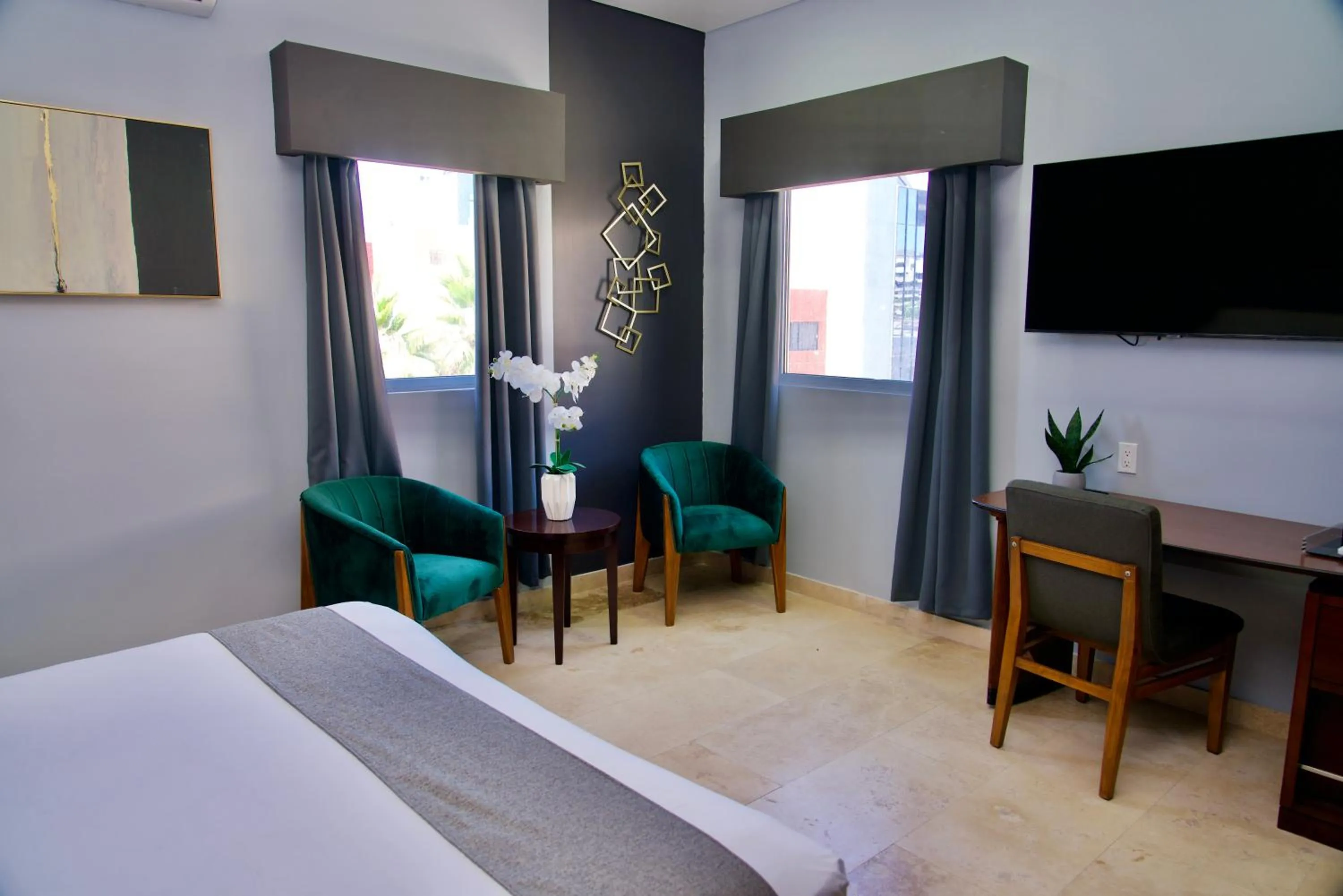 Seating area, Bed in Rio Suites