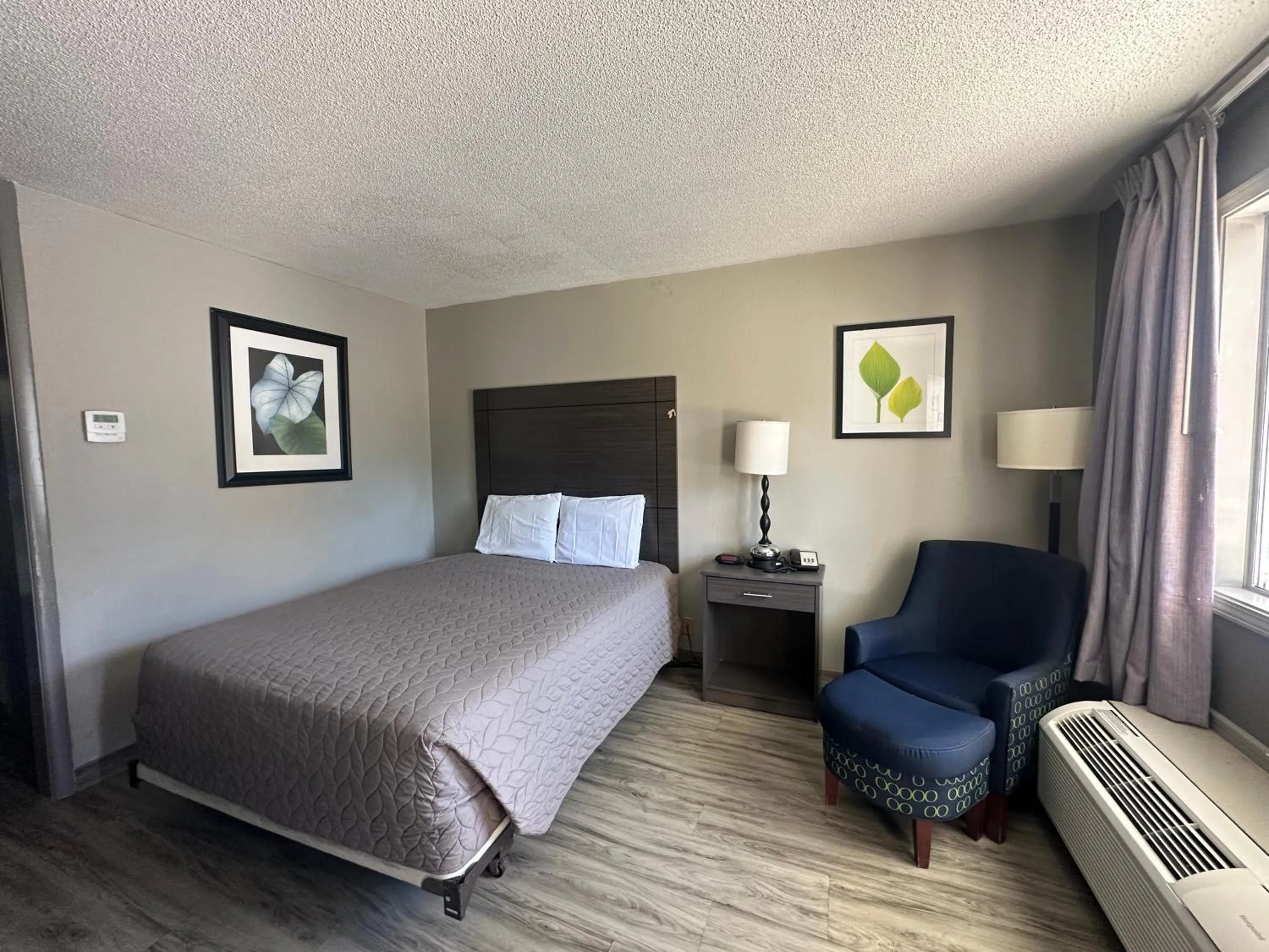 Bedroom in Executive Inn Locust Grove by Capital O
