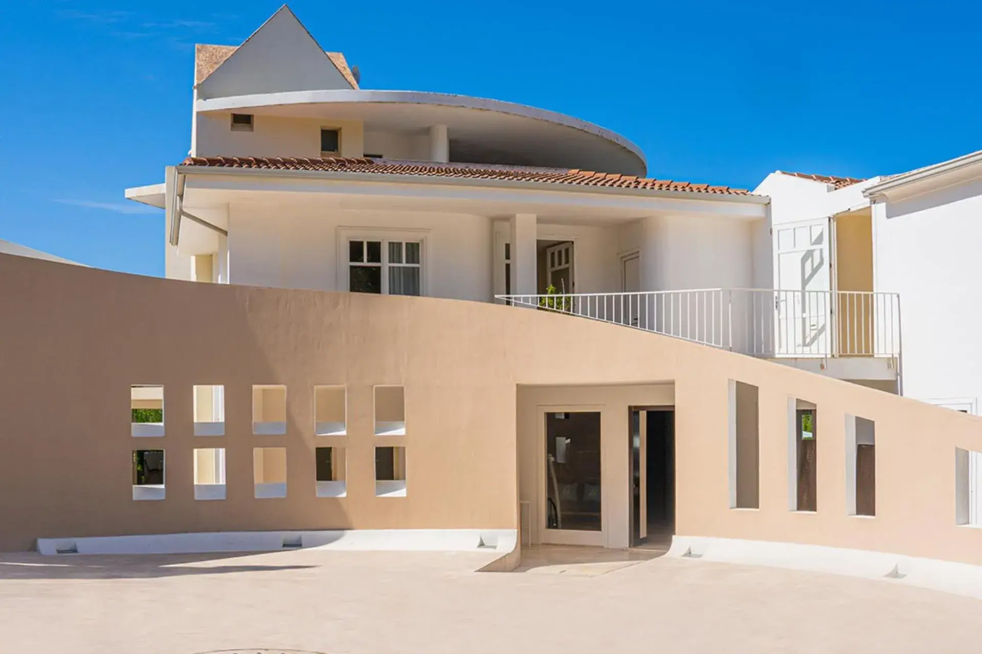 Property building in Felix Hotels - Hotel La Coluccia Property building in Felix Hotels - Hotel La Coluccia