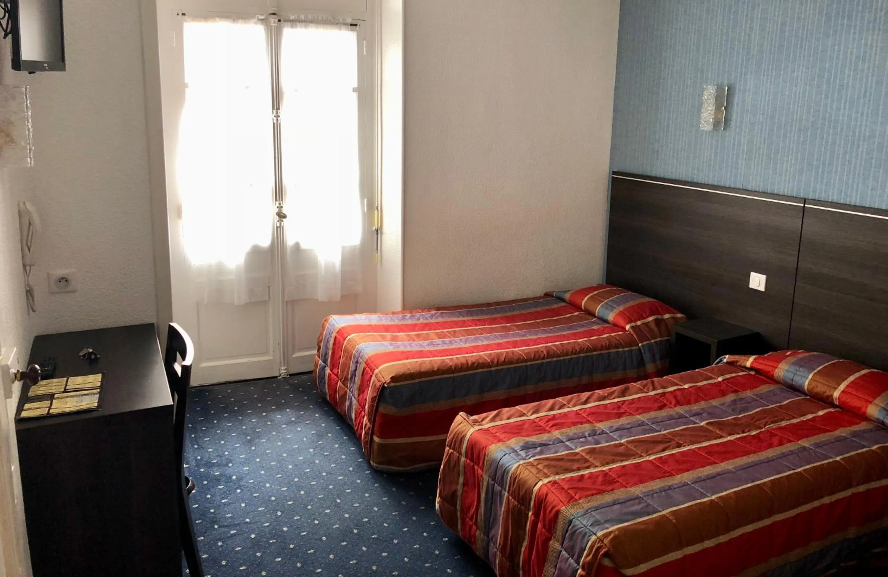 Bed in Hôtel Métropole