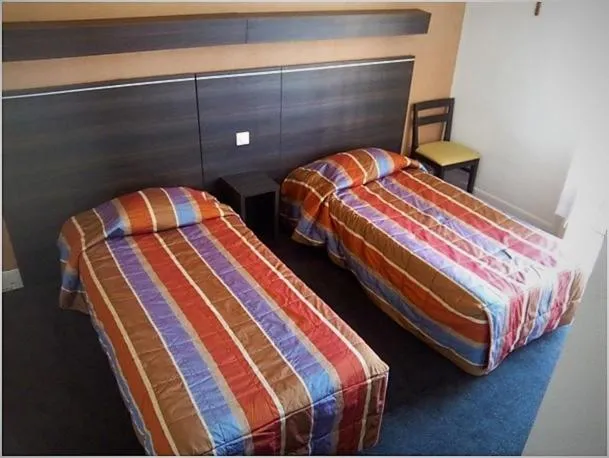 Bed in Hôtel Métropole