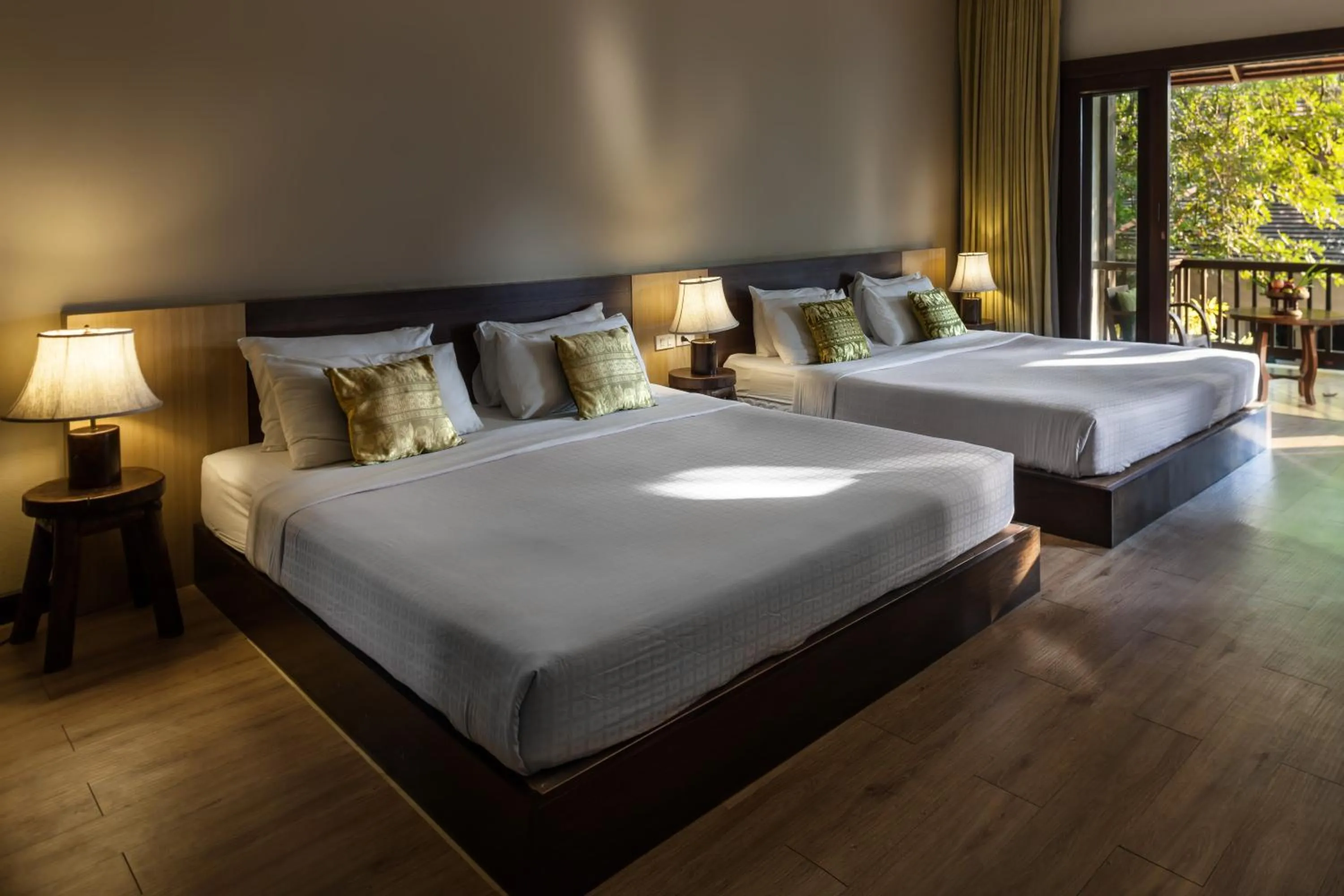 Bed in Lanna Dusita Riverside Boutique Resort