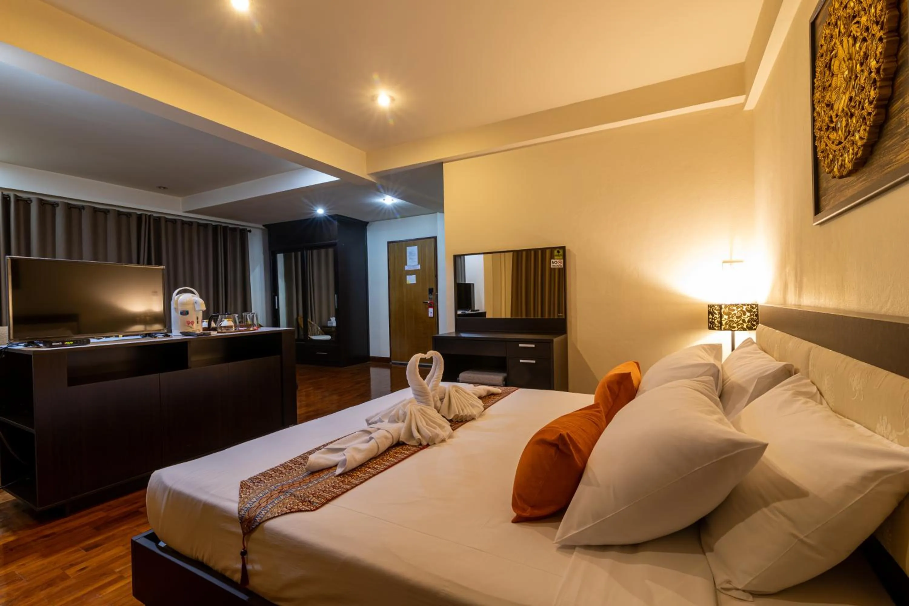 Bed in The Palm Garden Hotel