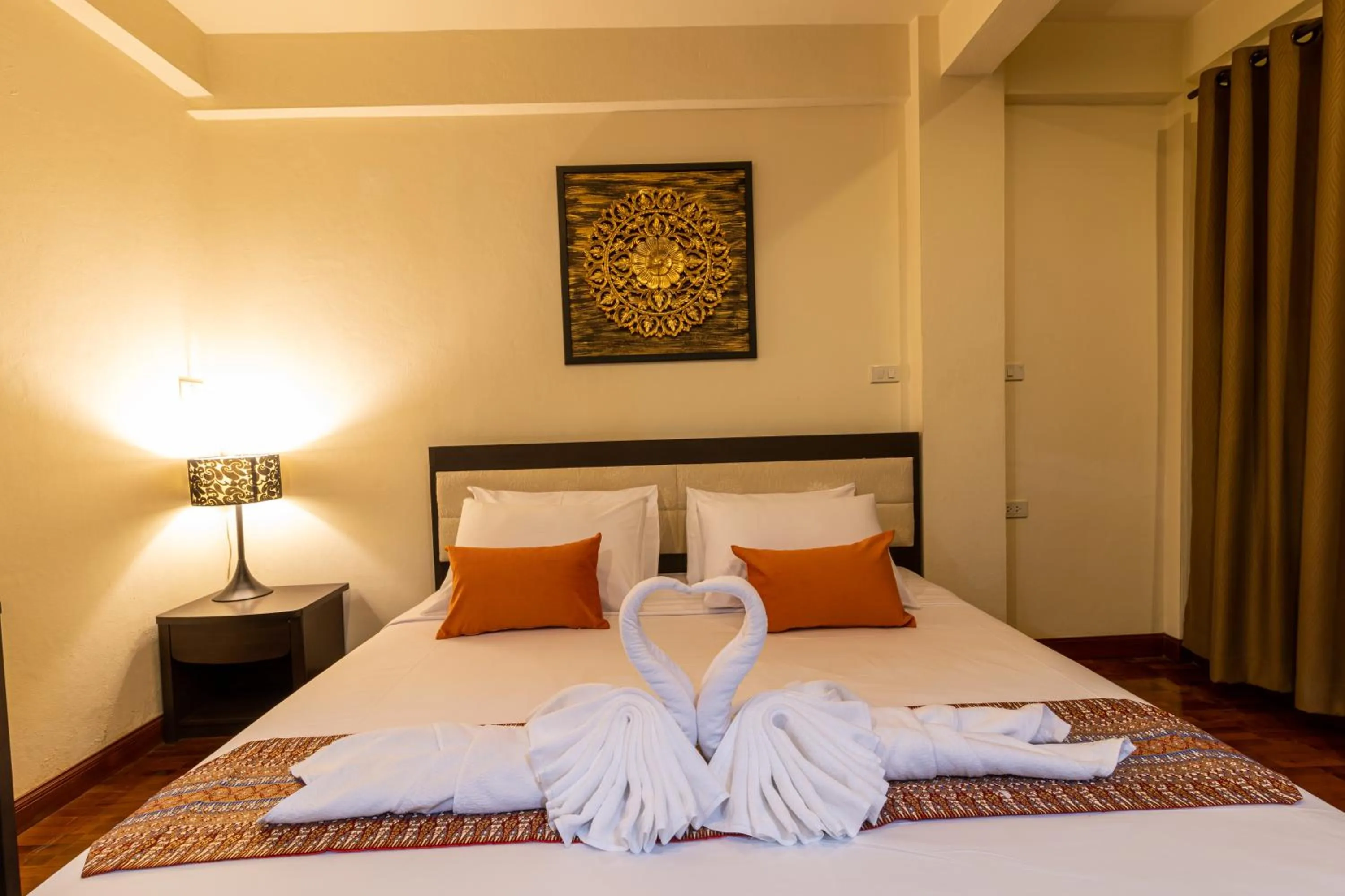 Bed in The Palm Garden Hotel