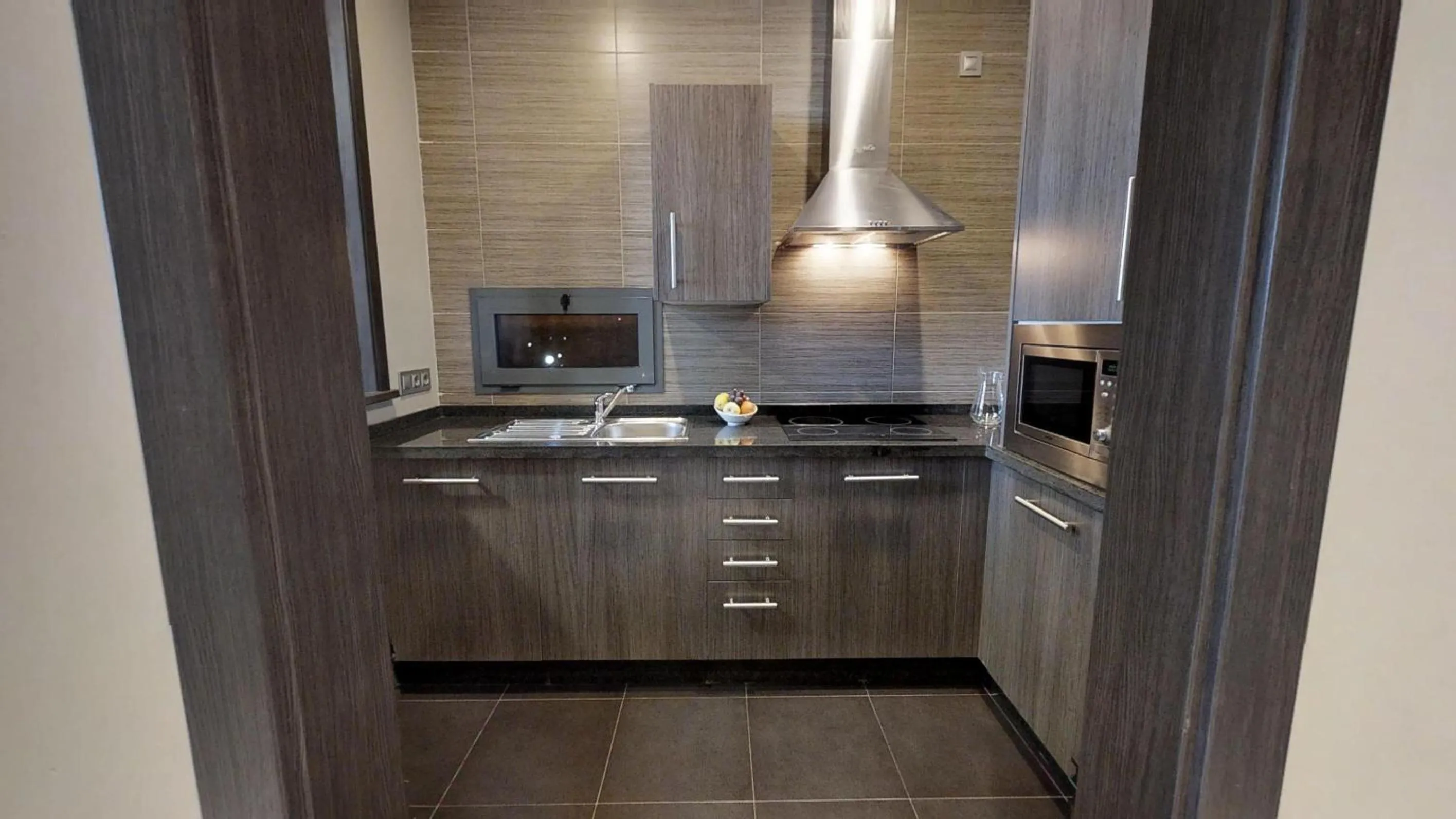 Kitchen or kitchenette in Leo Deluxe Punta Umbría