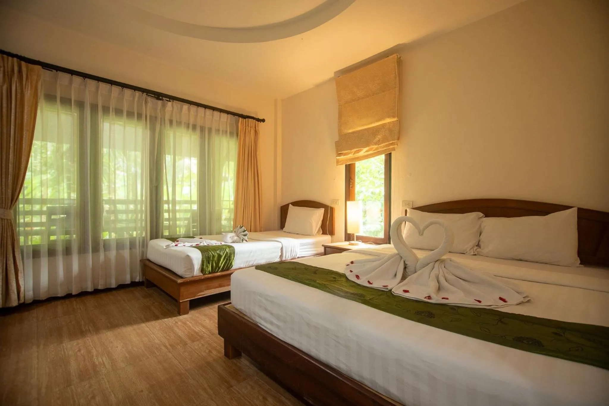 Bed in The Vatika Resort and Spa