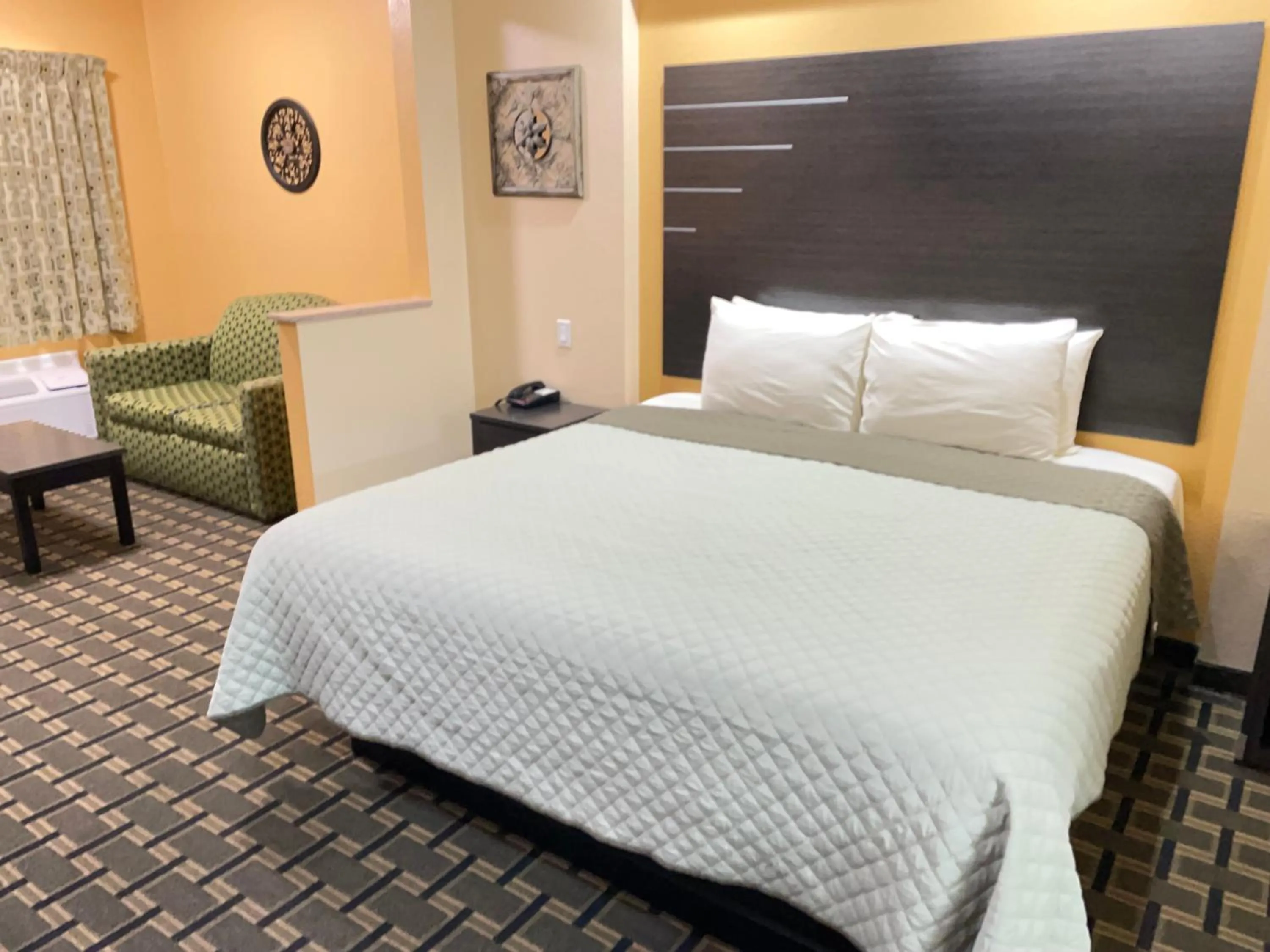 Bed in Homegate Inn & Suites West Memphis