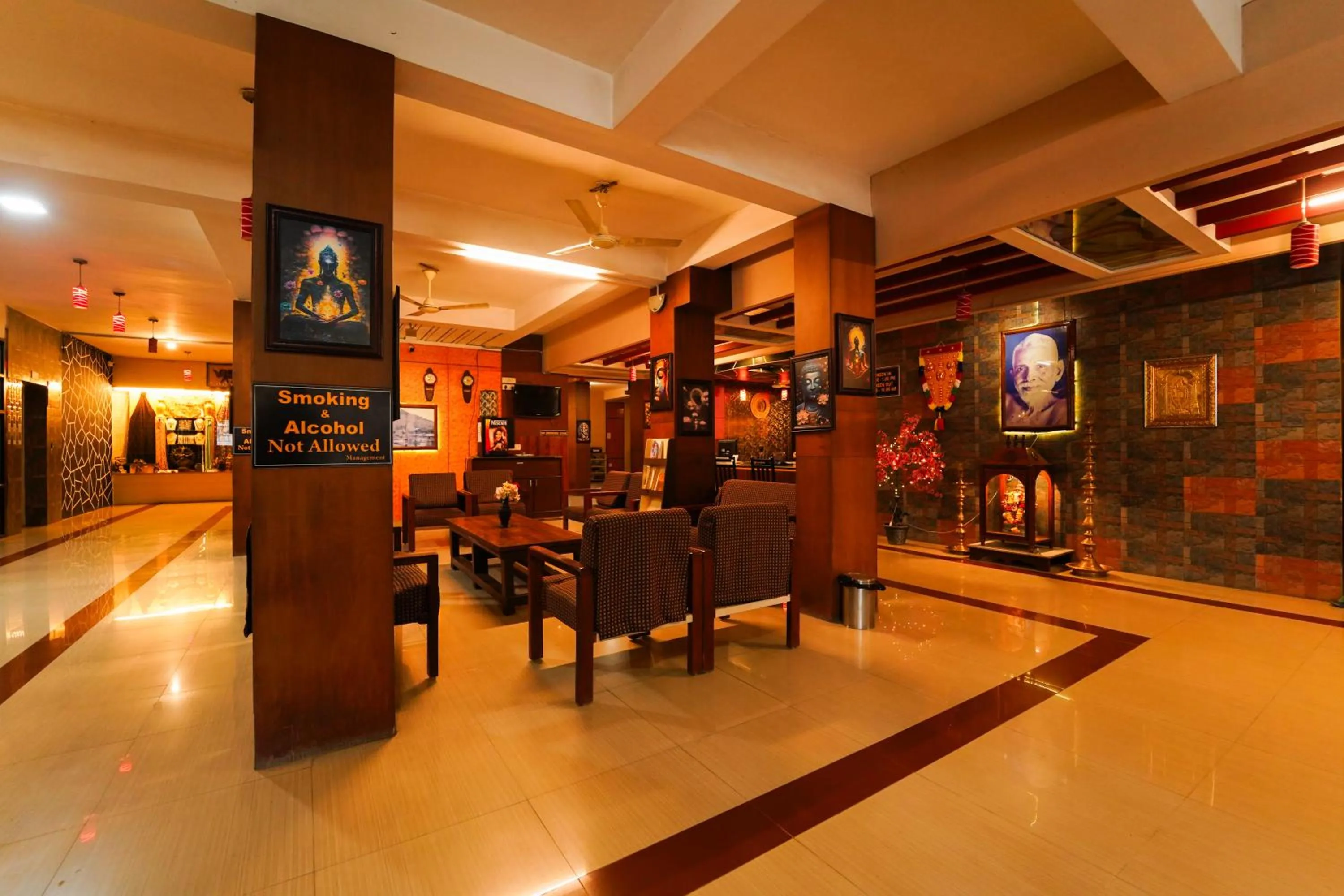 Seating area in HOTEL THIRD EYE by RAMANA TOWERS