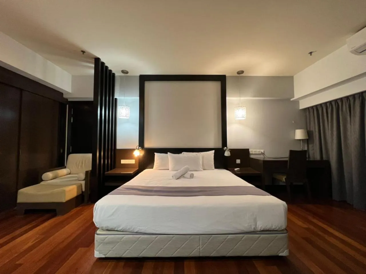 Bed in Raintree Resort Suites