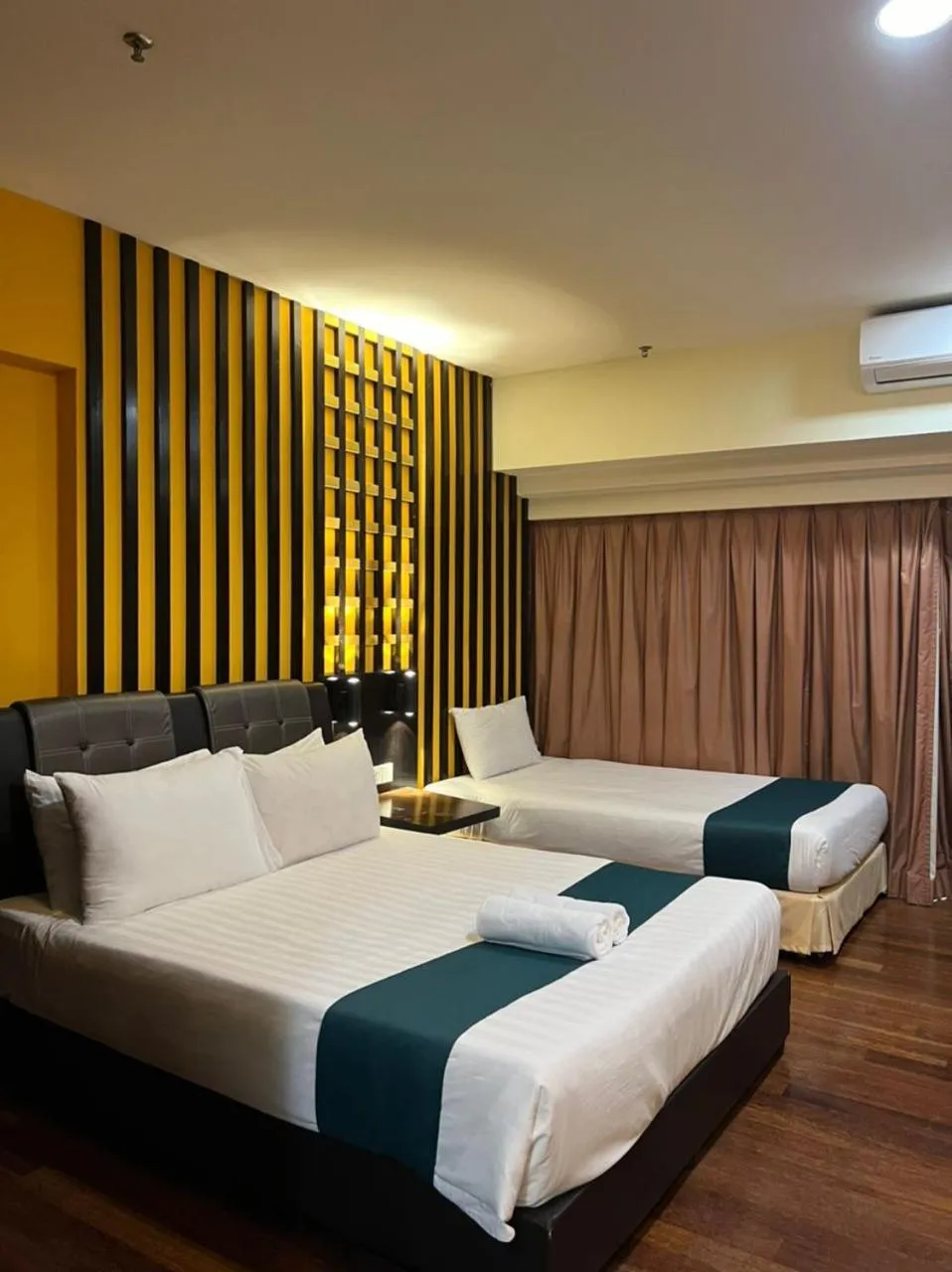 Bed in Raintree Resort Suites