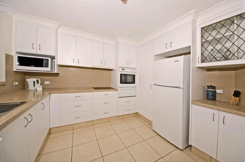 Kitchen or kitchenette in Genesis Apartments by Gold Coast Premium