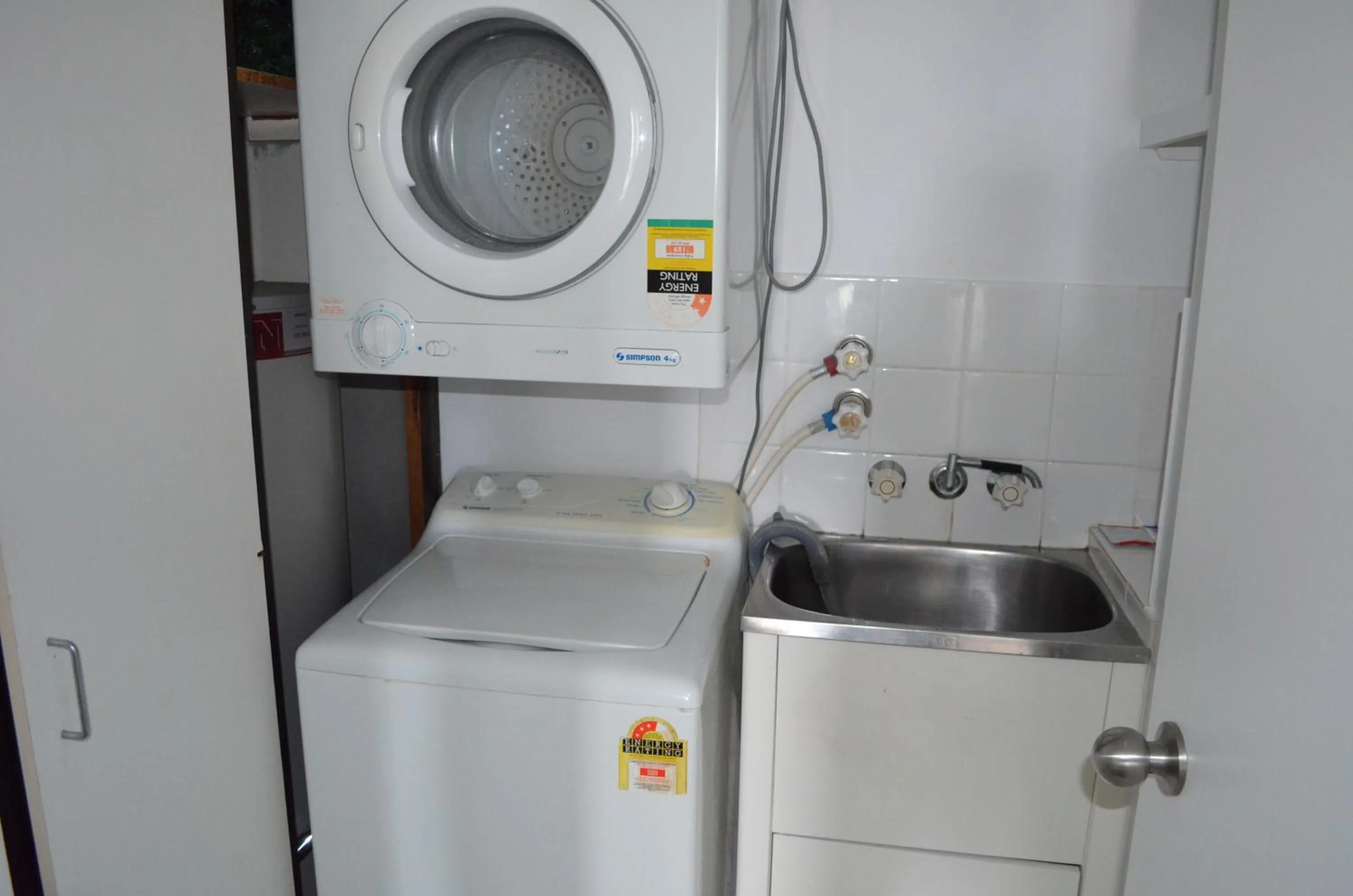 washing machine in Genesis Apartments by Gold Coast Premium