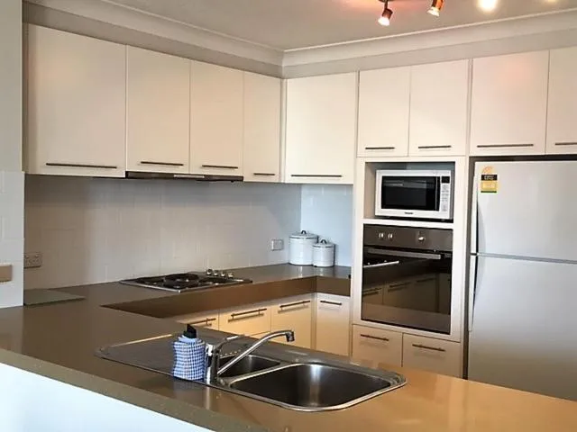 Kitchen or kitchenette in Genesis Apartments by Gold Coast Premium