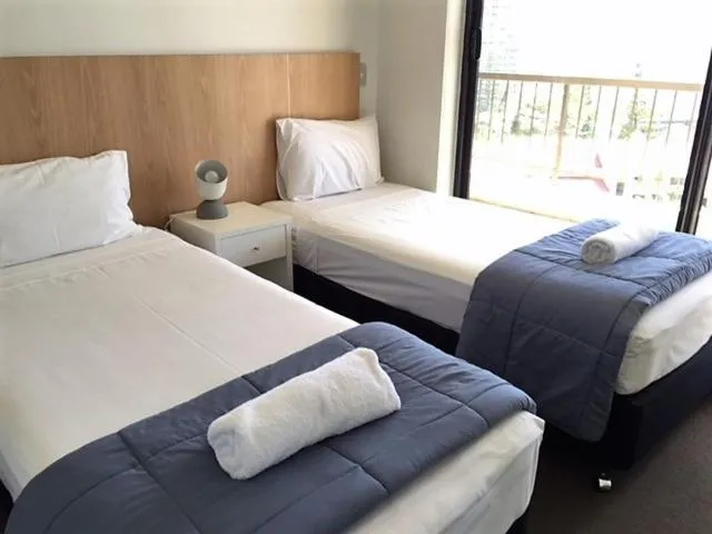 Bedroom, Bed in Genesis Apartments by Gold Coast Premium
