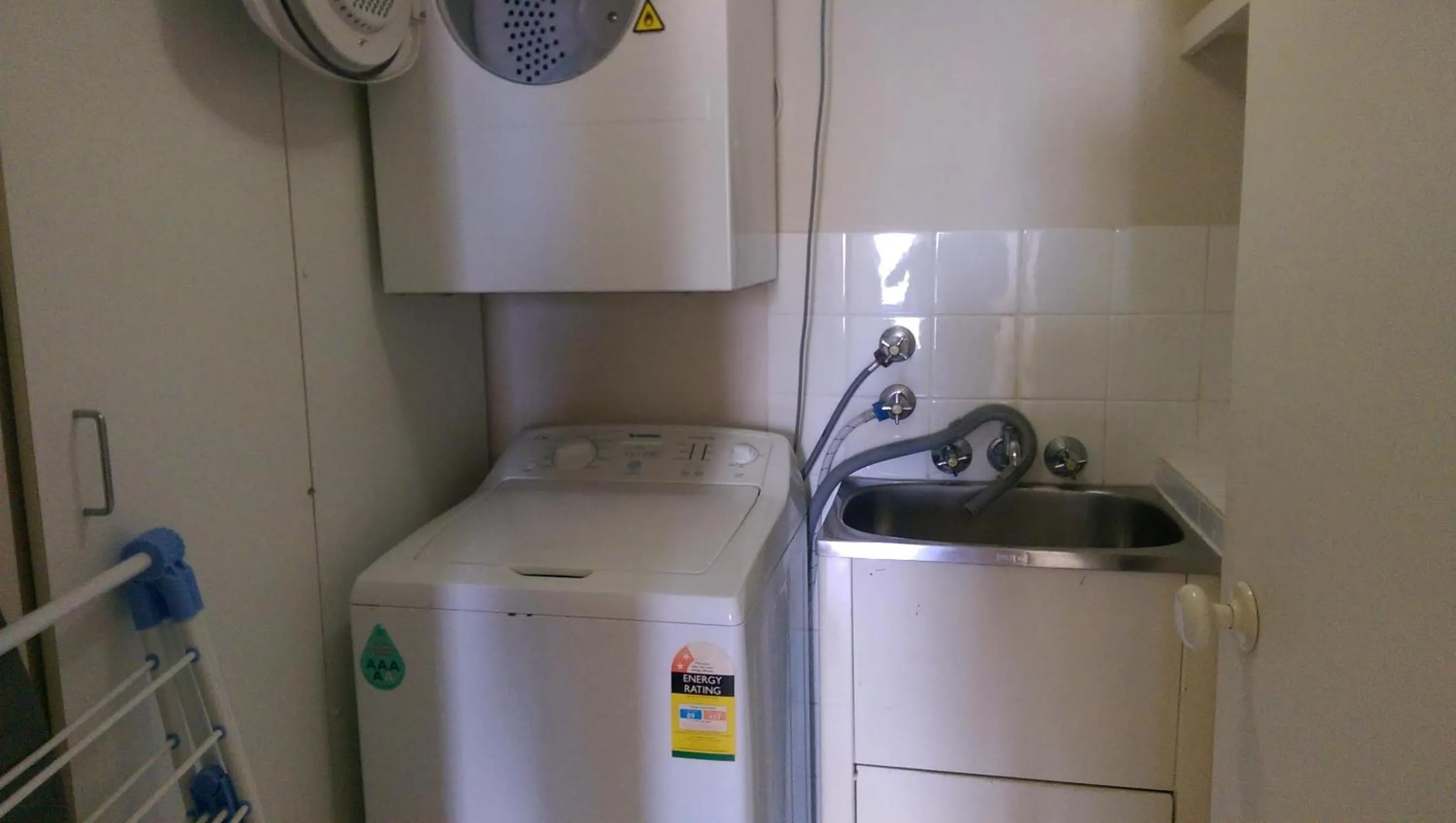 washing machine in Genesis Apartments by Gold Coast Premium